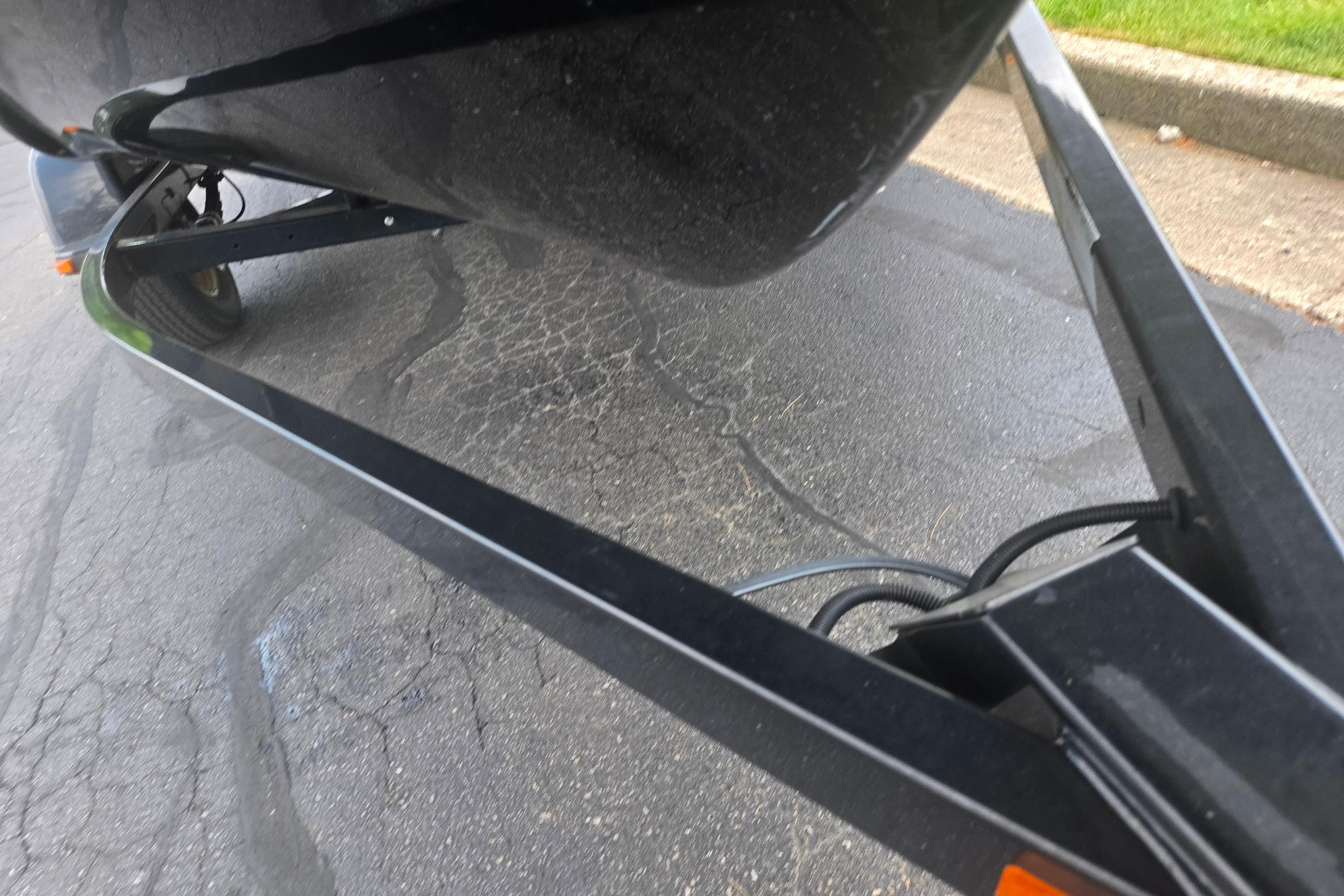 Trailer for 2016 Yamaha Boats AR192 on pavement.