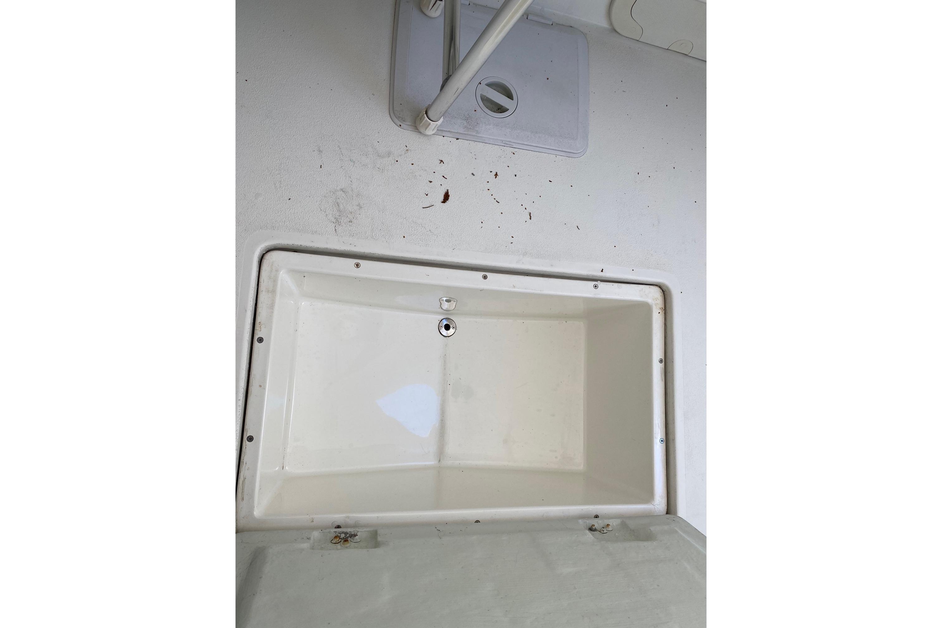 Open storage compartment on 2007 Roth Bilt 24 CC boat deck.