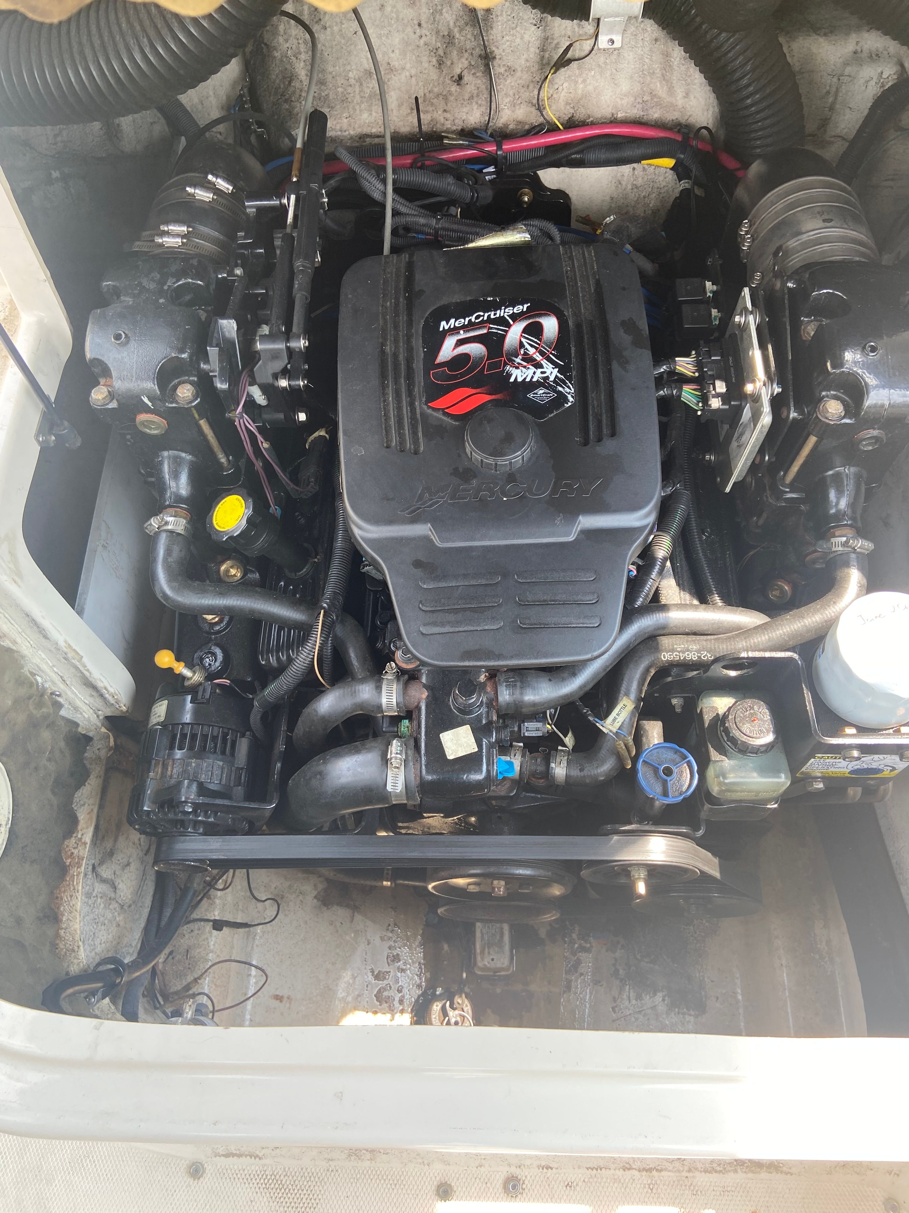 Engine compartment of a 2004 Sea Ray 200 Sundeck boat with a MerCruiser engine.
