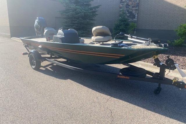 2026 Tracker Bass Tracker Classic Limited boat on trailer, parked outdoors.