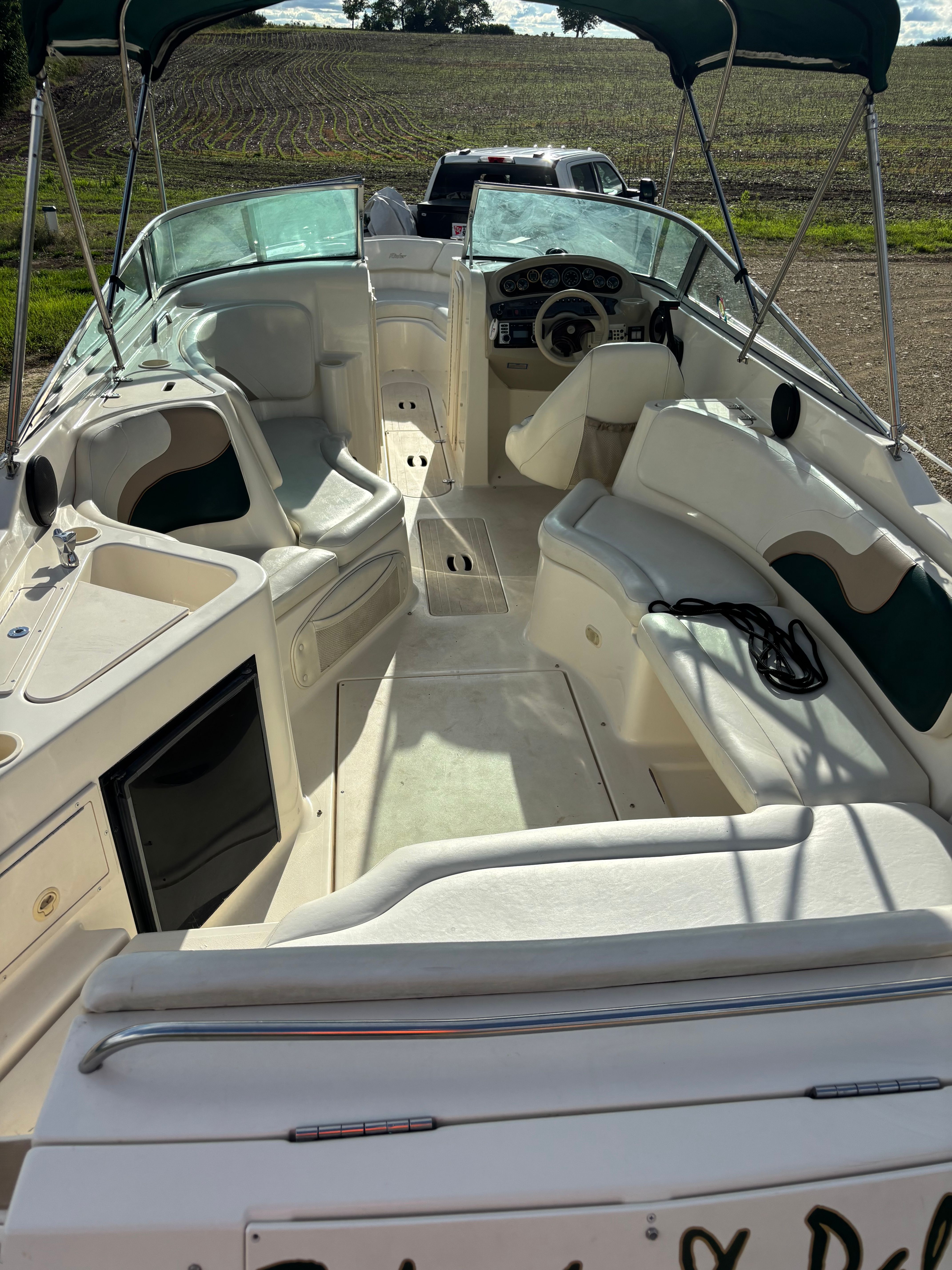 Interior view of a 1999 Rinker Captiva 272 boat with seating.
