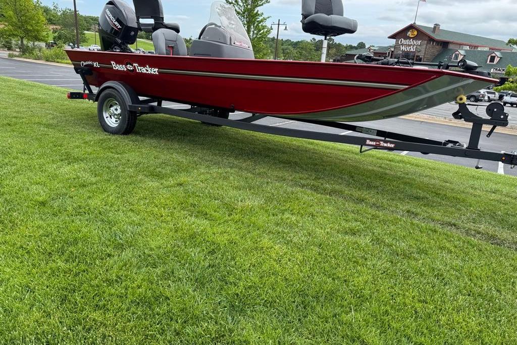 2026 Tracker Bass Tracker Classic XL boat on trailer, parked on grass.