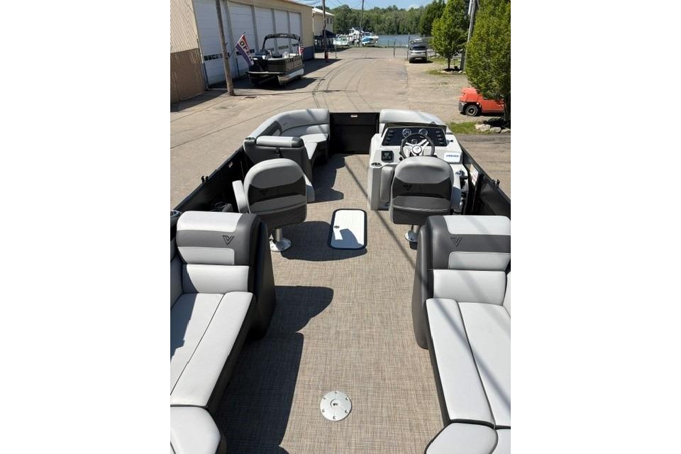 2023 Viaggio Lago 22U Tri Toon boat interior with plush seating and modern dashboard.