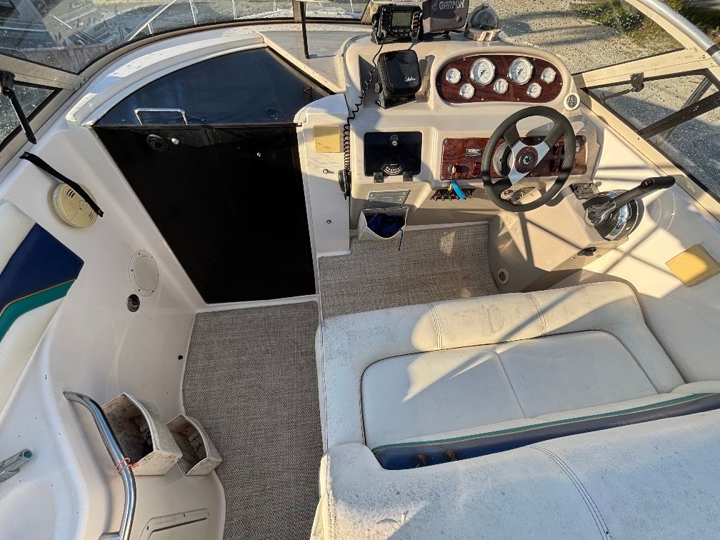 Interior of a 1997 Donzi 275LXC boat with steering console.