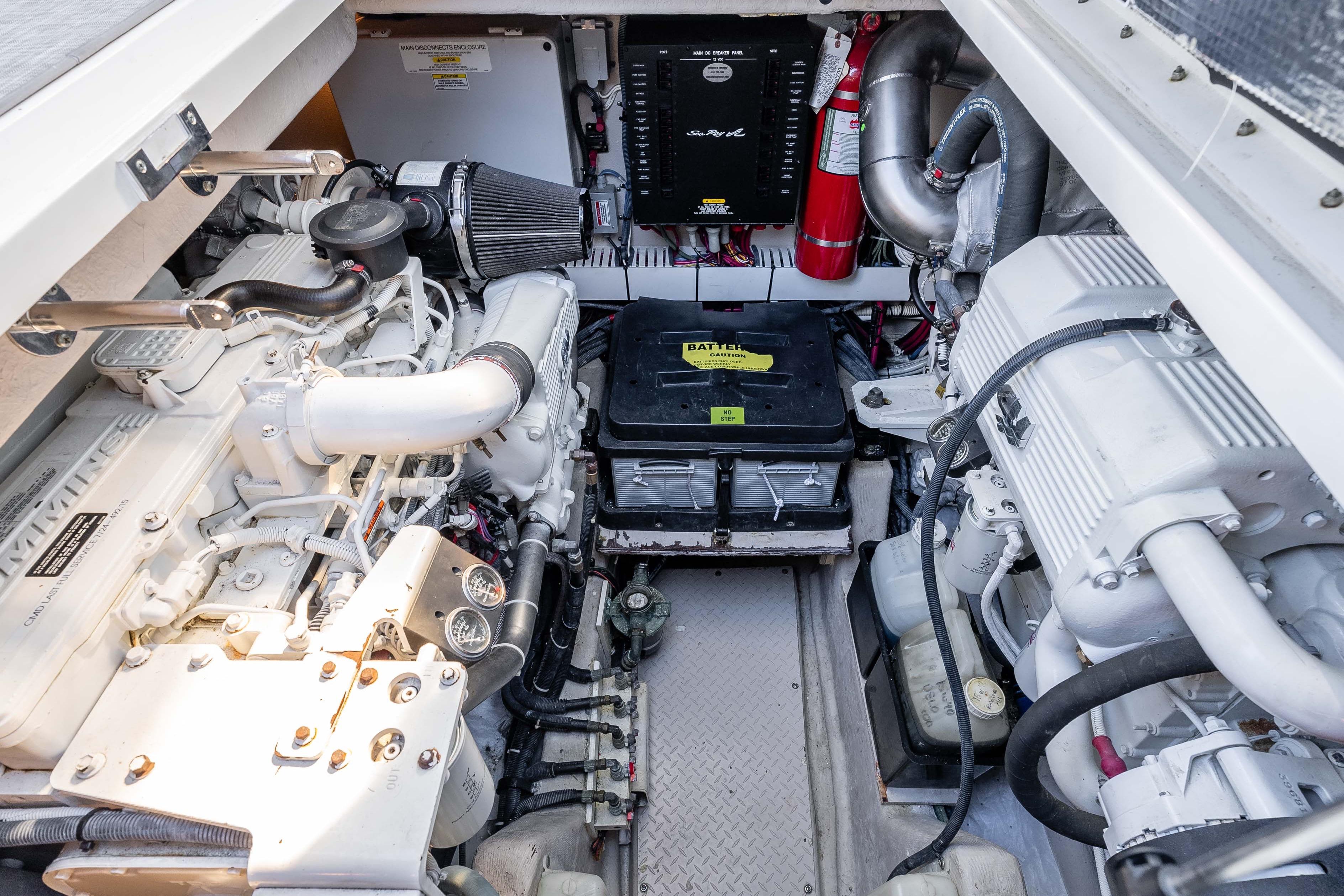 Engine room of a 2007 Sea Ray 48 Sundancer yacht, showcasing mechanical components.