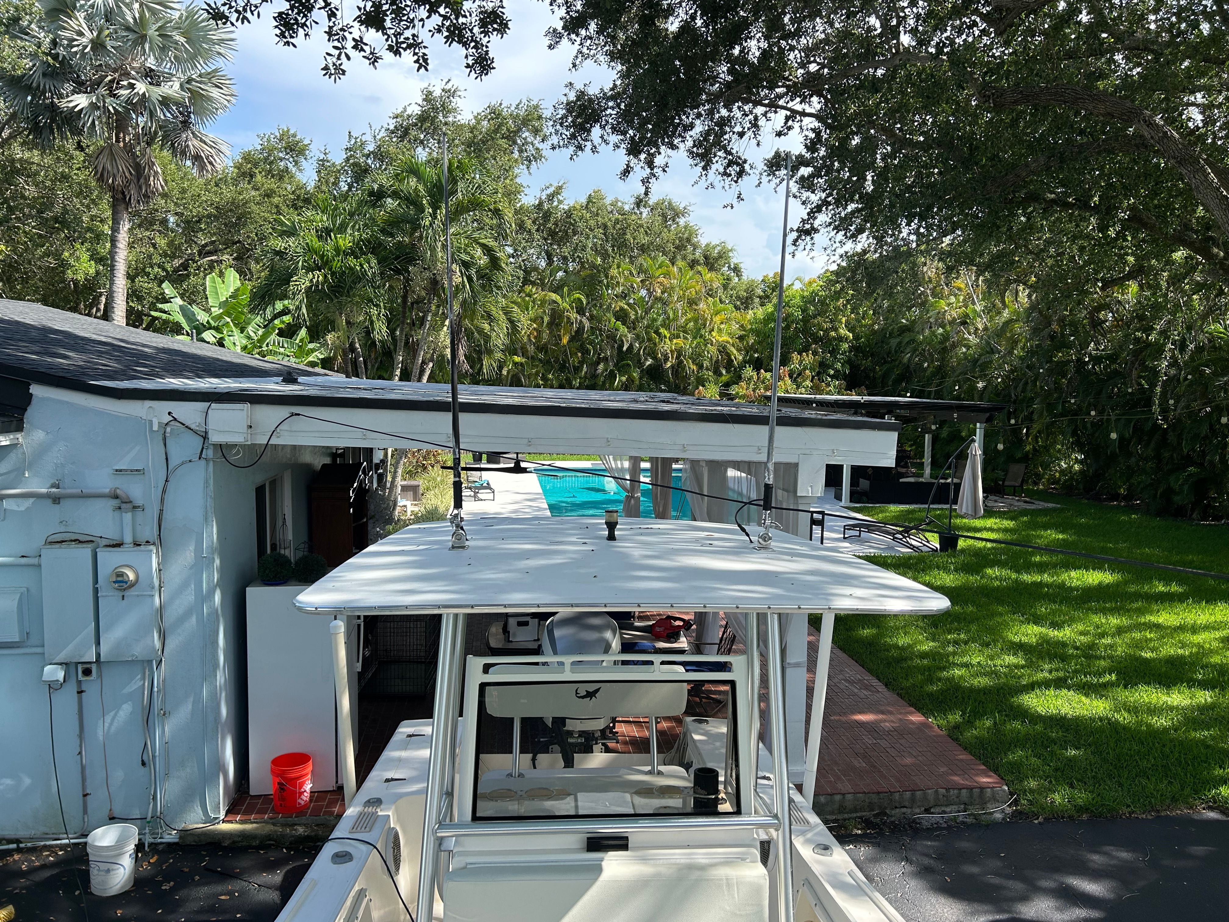 1992 Mako 221 boat parked in a garden setting.