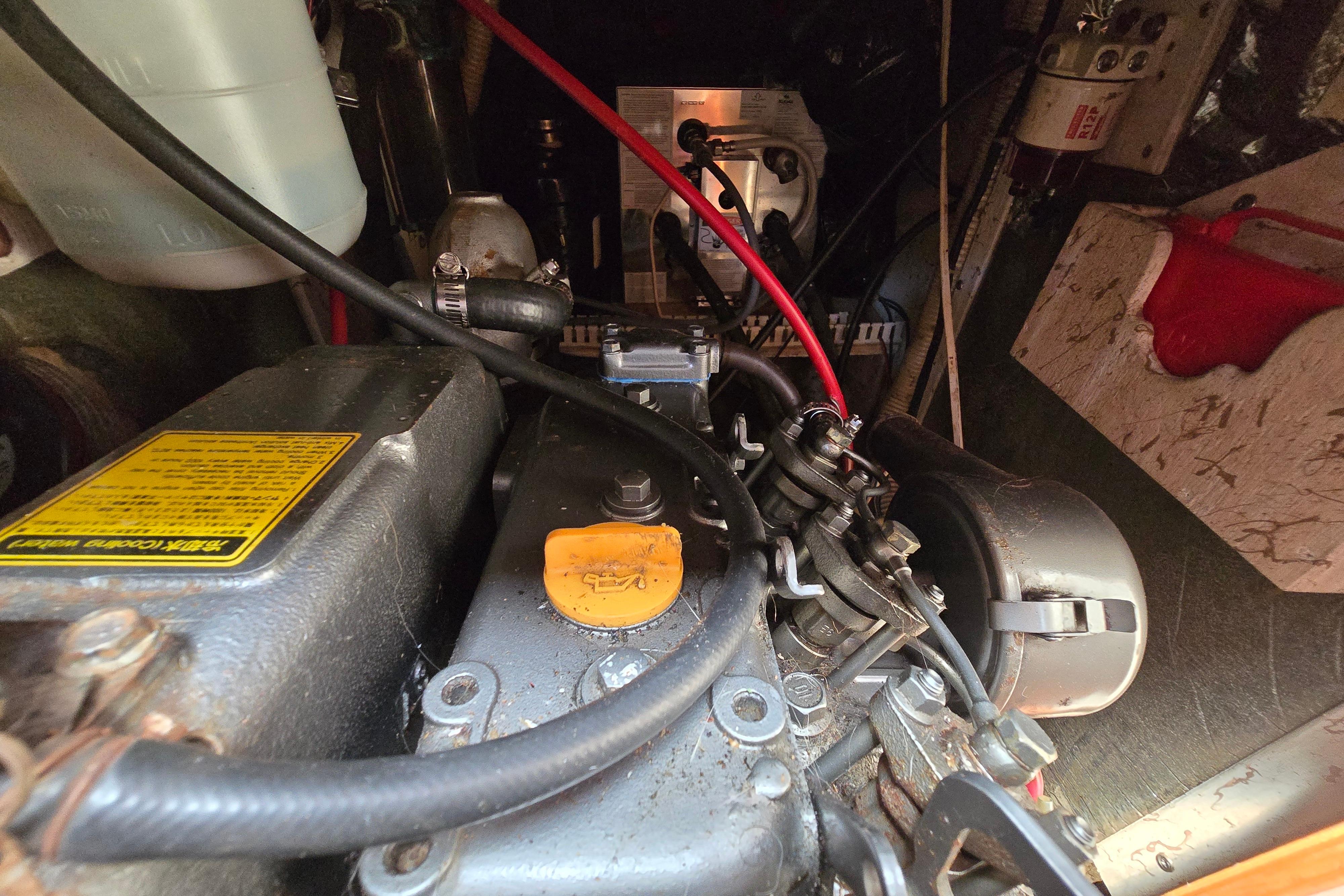 Engine compartment of a 1993 Caliber 35, showcasing mechanical components and wiring.