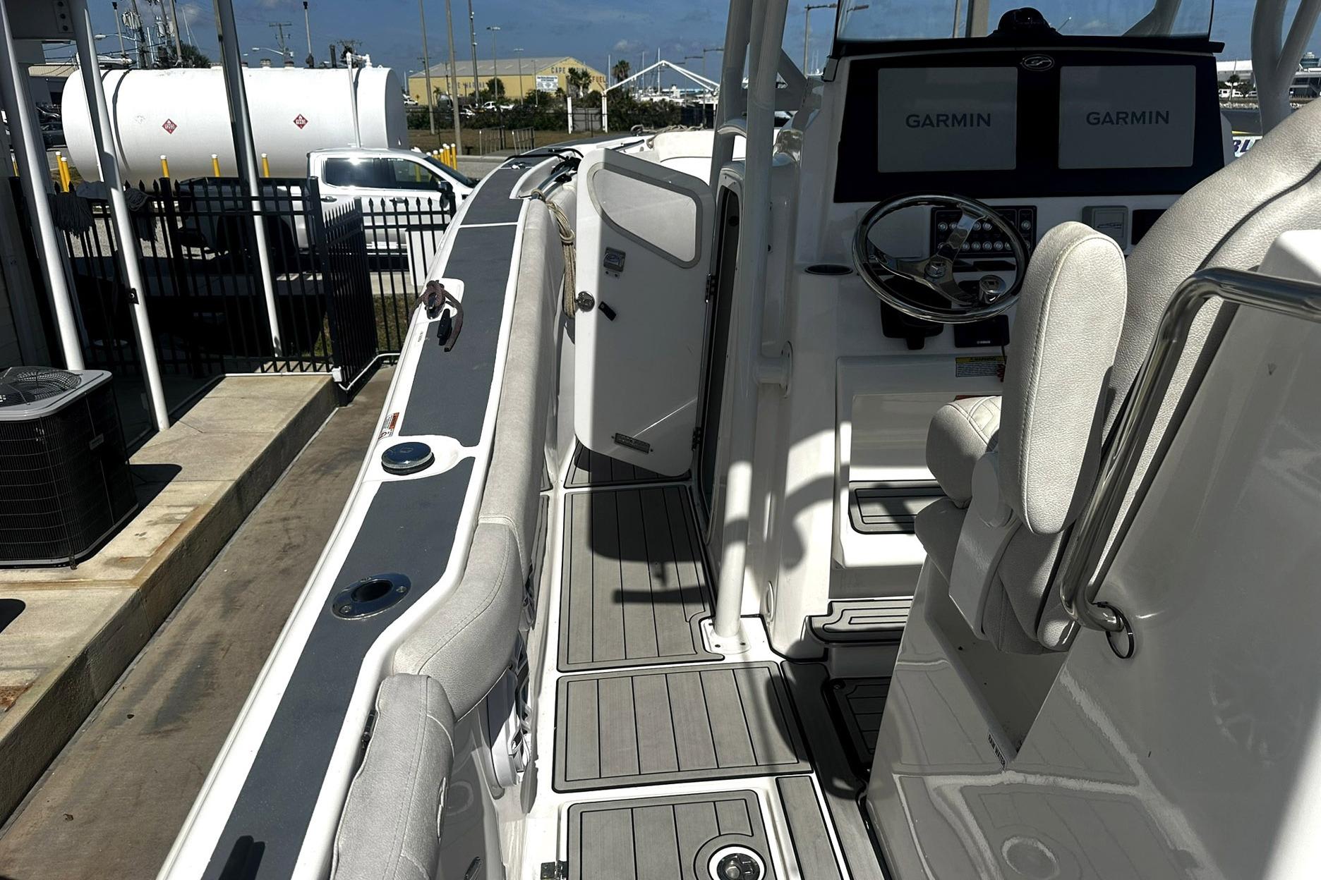 Interior view of a 2002 Sea Fox 228 Commander boat with Garmin navigation displays.