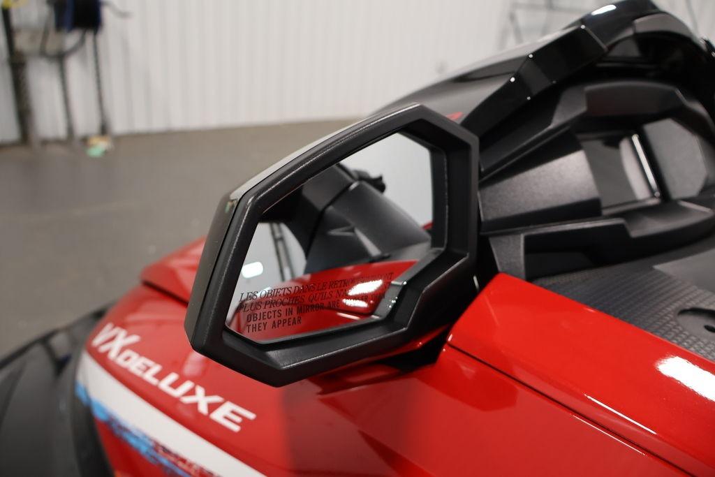 2026 Yamaha WaveRunner VX Deluxe, red exterior, side mirror detail in focus.