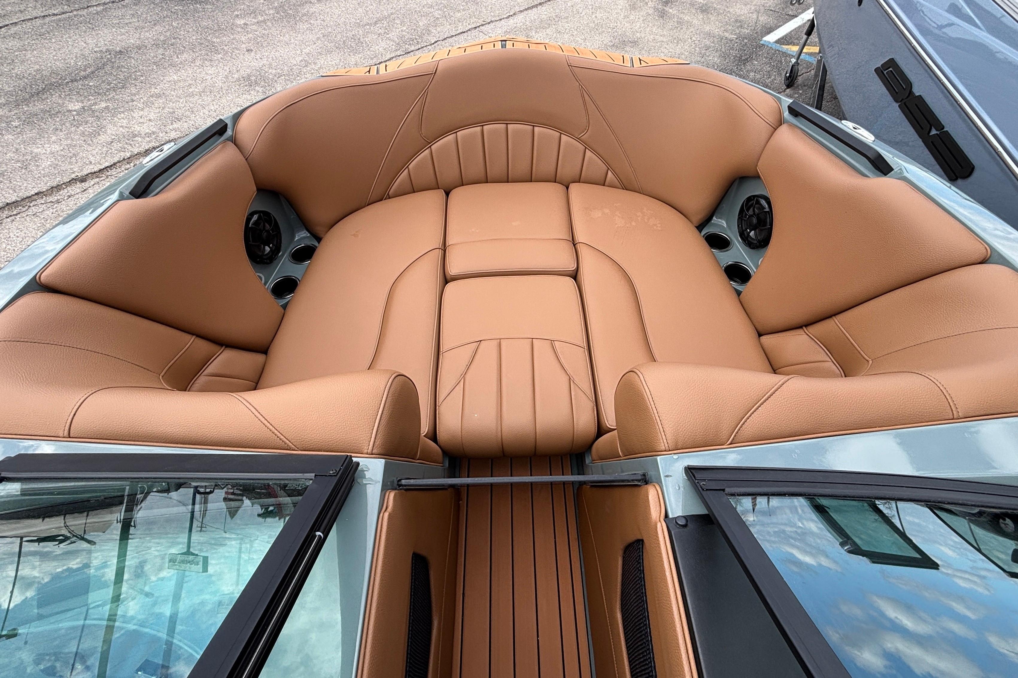 Luxurious tan leather seating in 2026 MB B52 23 Classic boat interior.