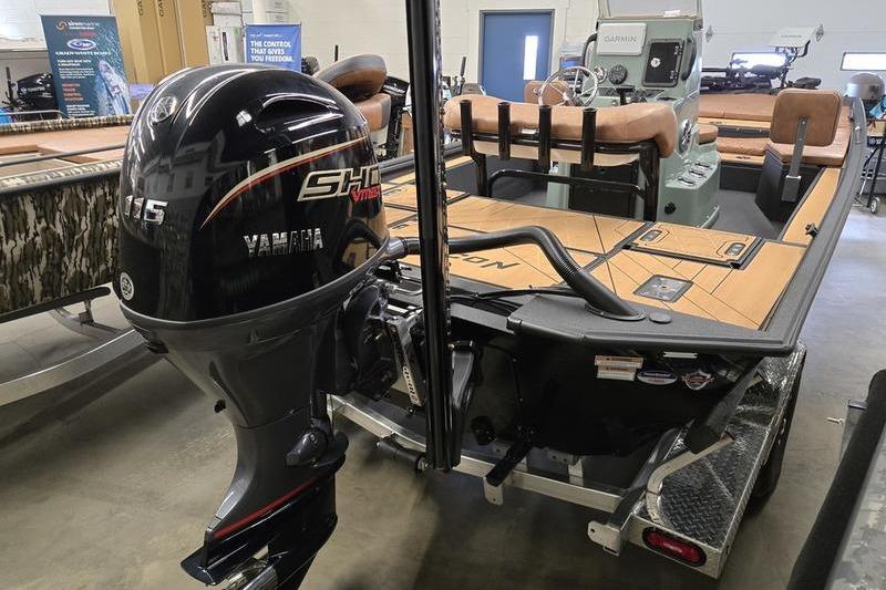 Avid 207 Recon 2026 boat with Yamaha 115 engine in showroom.