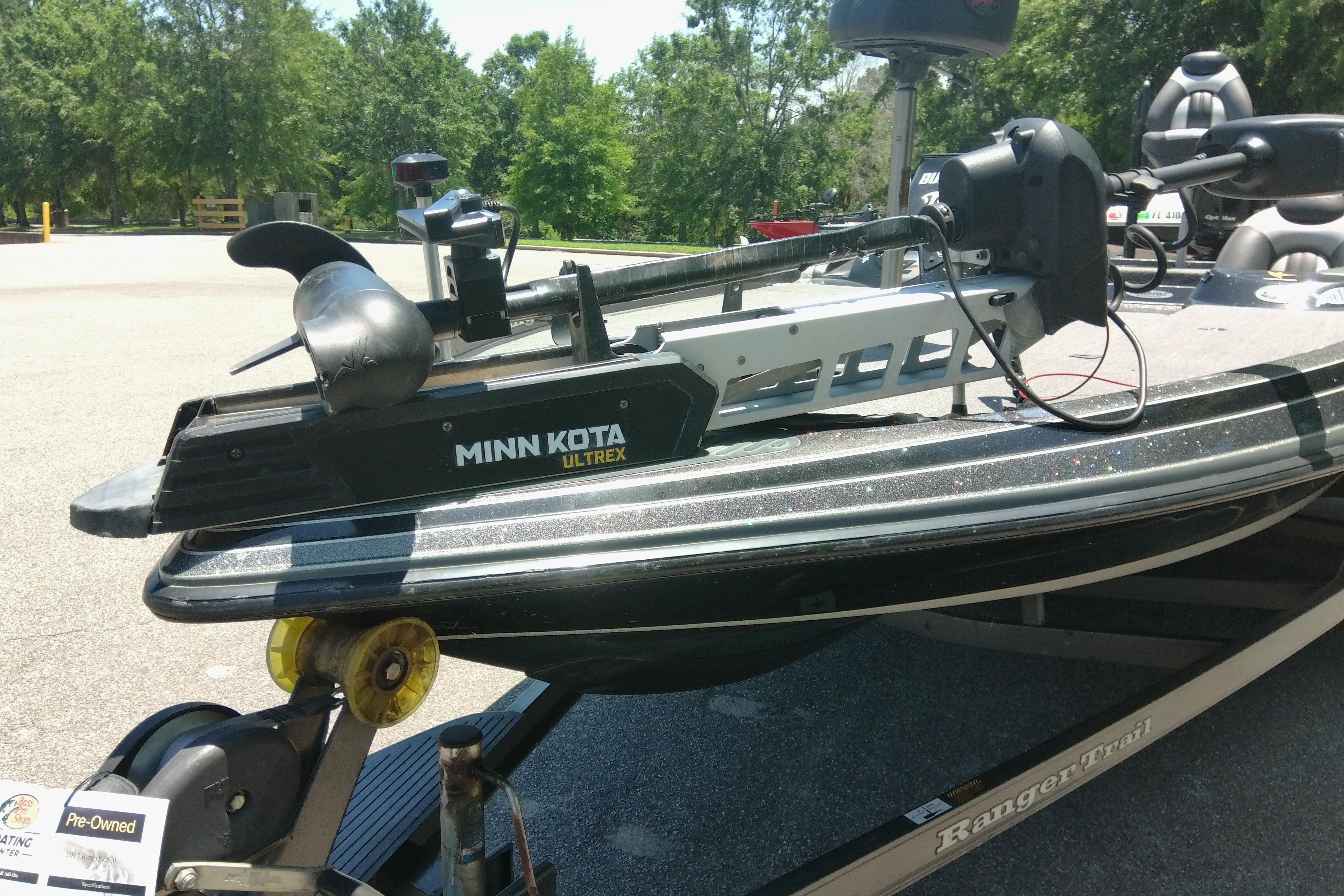 2012 Ranger Z520 boat with Minn Kota Ultrex trolling motor in a sunny outdoor setting.