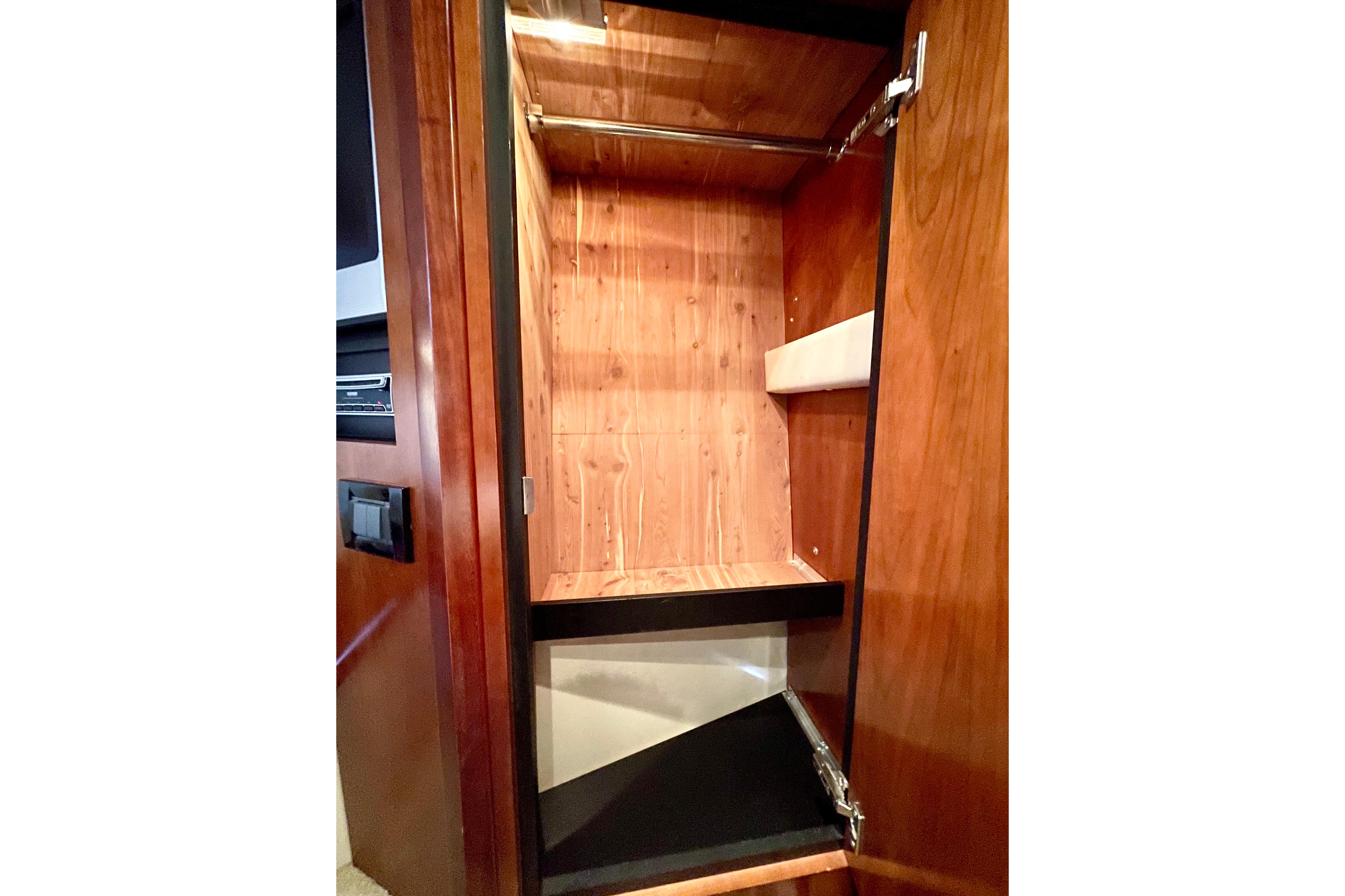 Wooden closet interior on 2011 Cruisers Yachts 390 Sports Coupe.