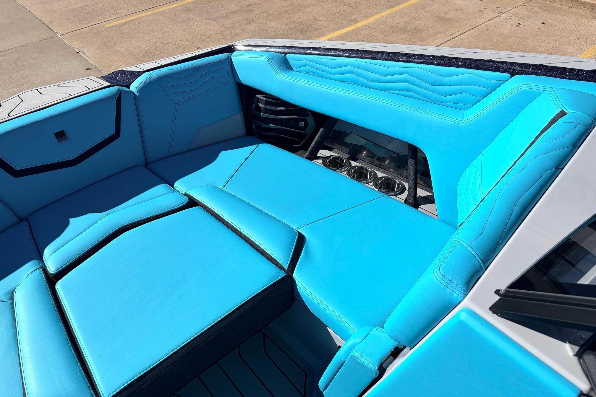 2026 Nautique Super Air Nautique G23 interior with vibrant blue seating and sleek design.