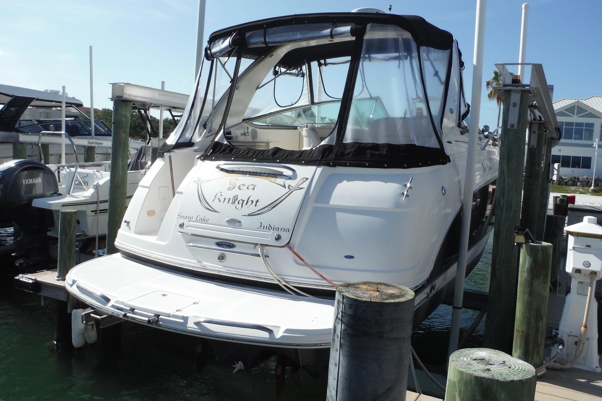 Chaparral Signature 350 boat from 2005 docked at a marina.