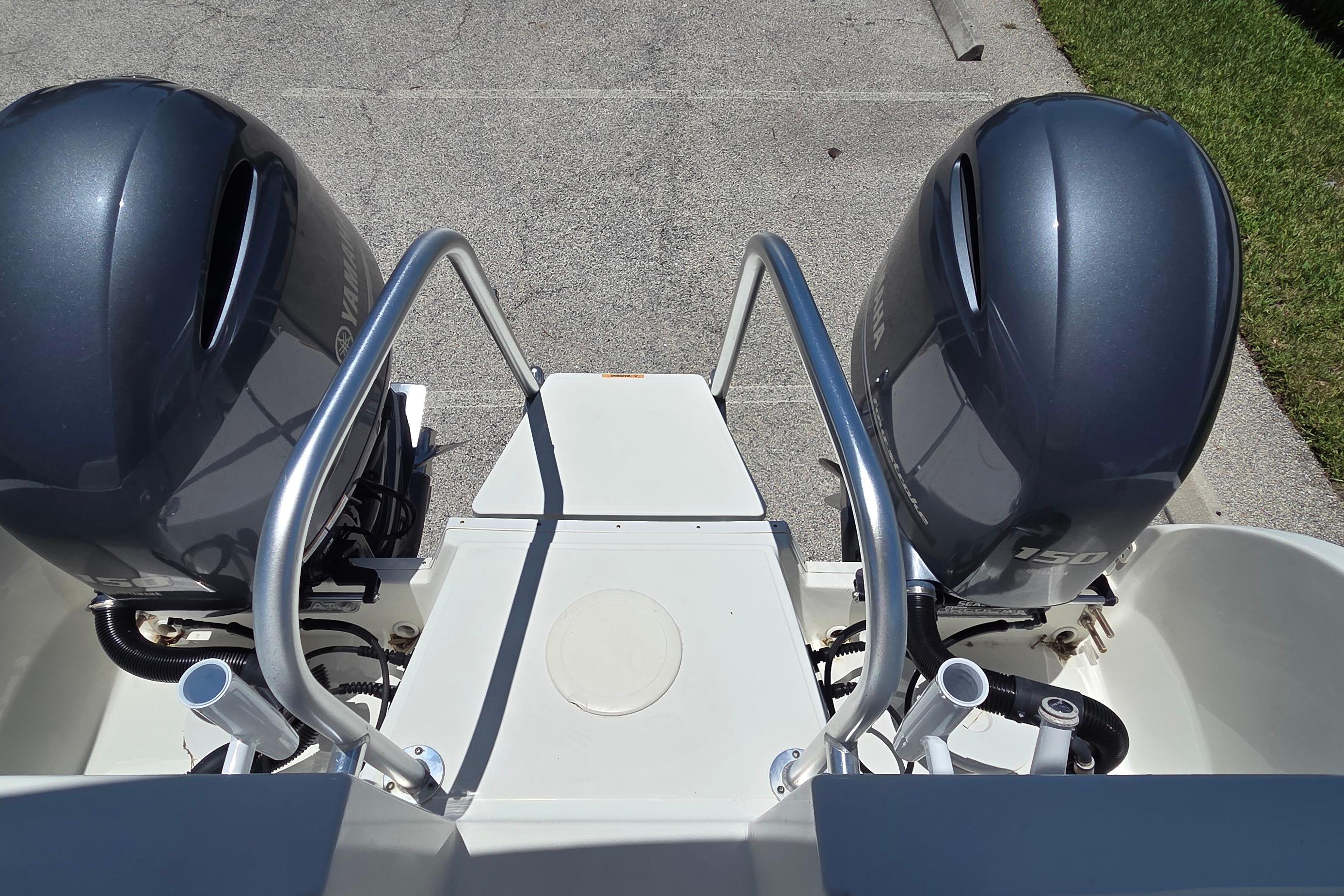 2022 World Cat 255 DC boat with dual outboard motors, viewed from above.