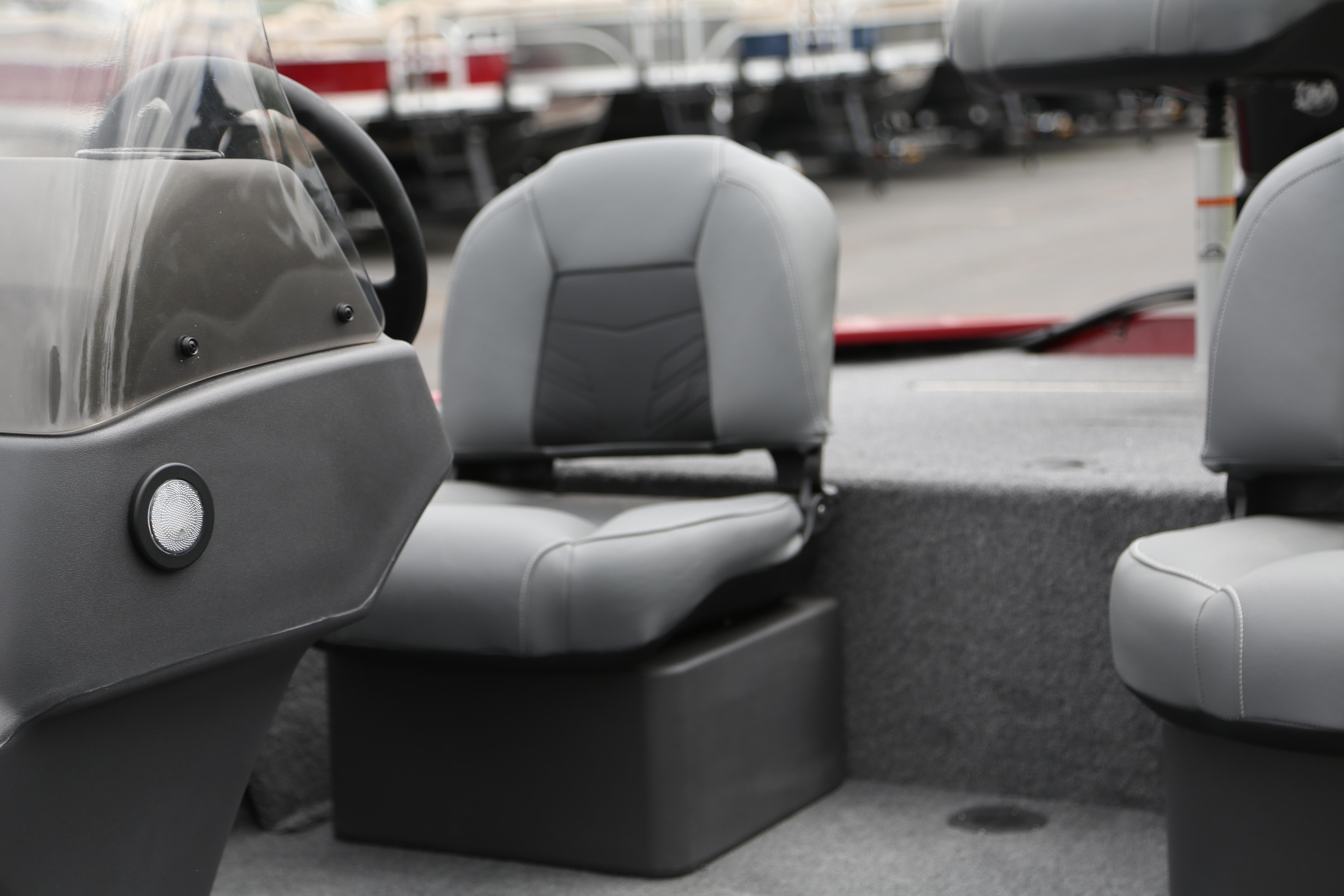 2026 Tracker Bass Tracker Classic XL boat interior with gray seating and steering console.