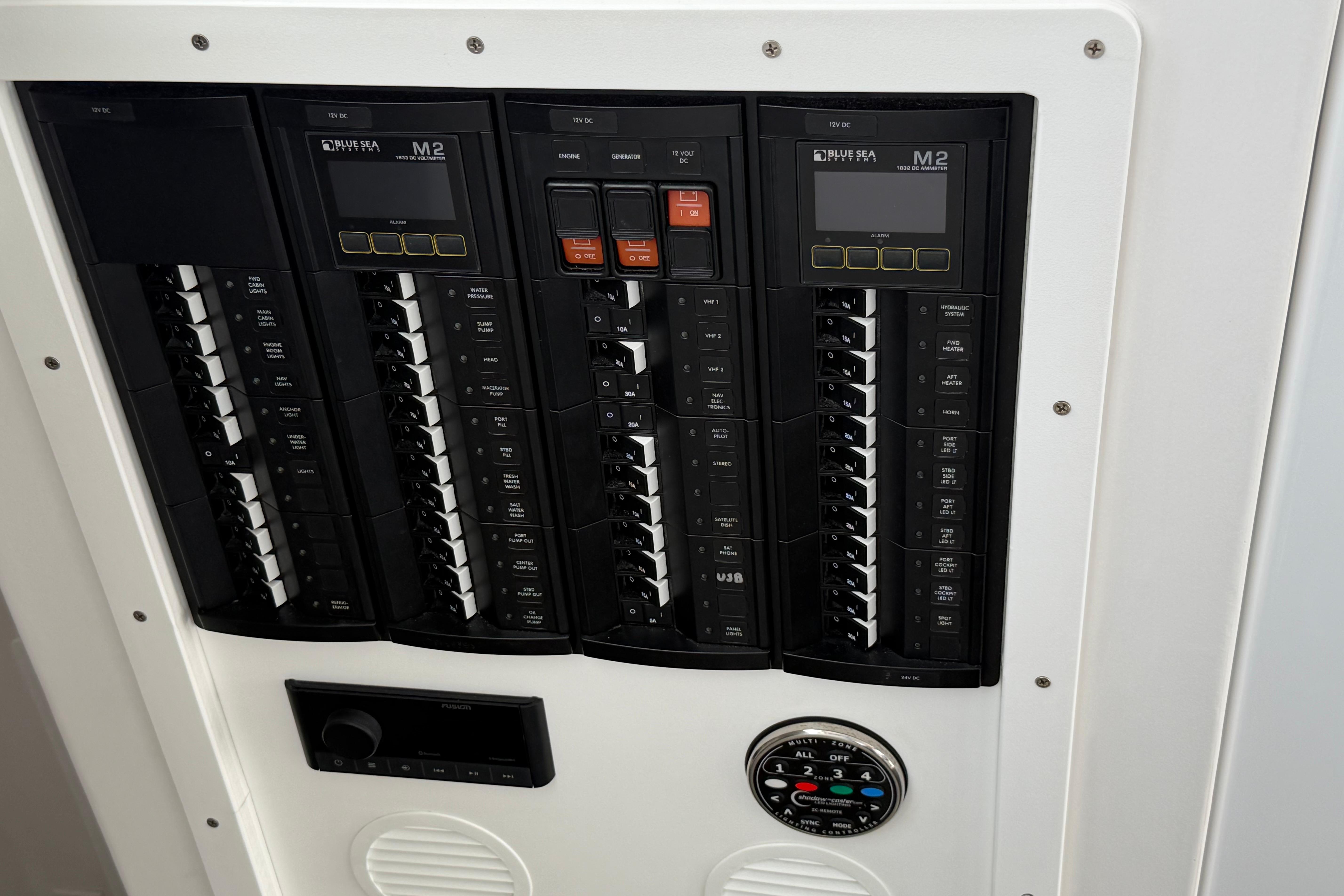 Electrical panel on a 2018 H&H Marine Osmond Beal boat, featuring circuit breakers and controls.
