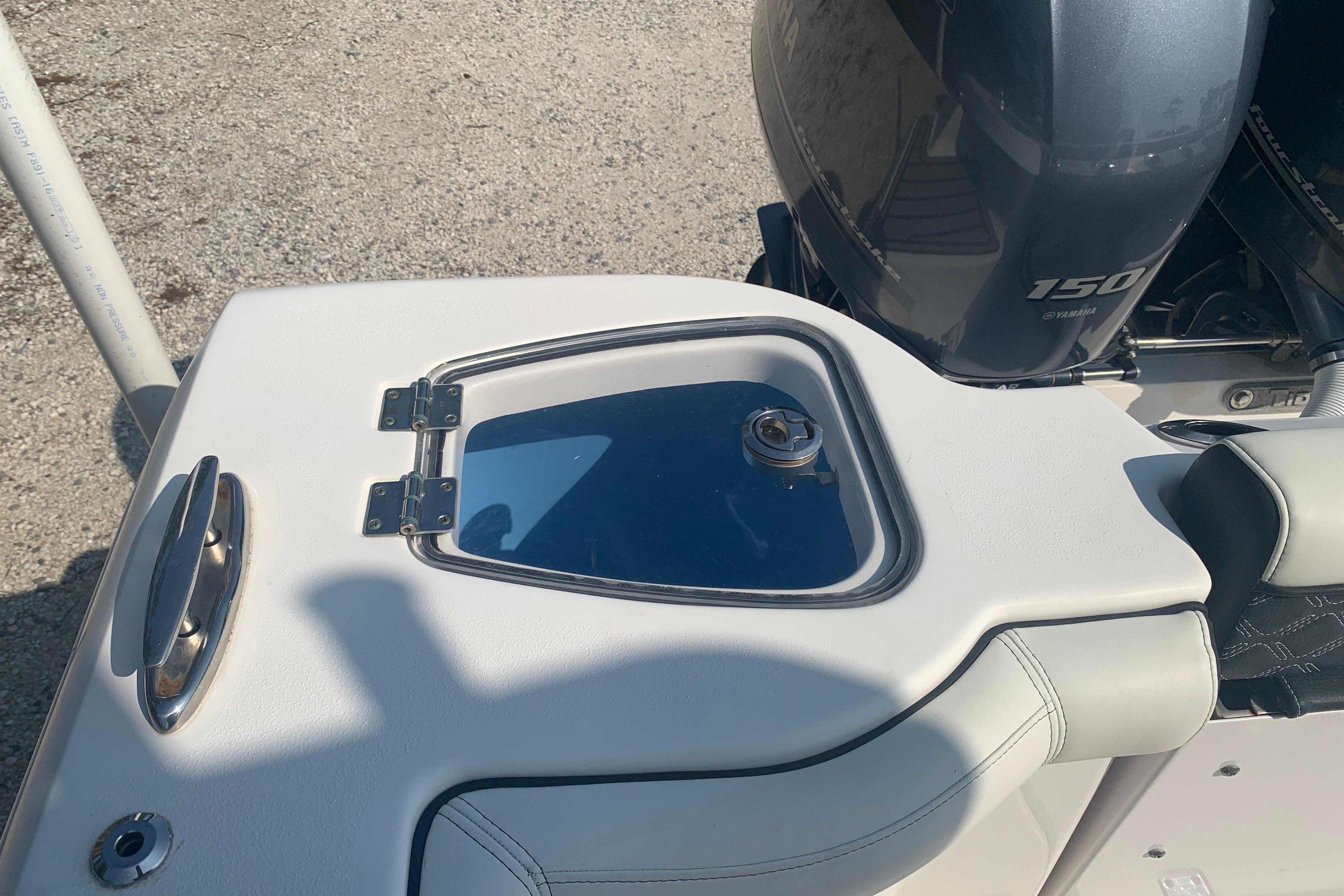 2021 Tidewater 256 CC Adventure boat with Yamaha 150 engine detail.