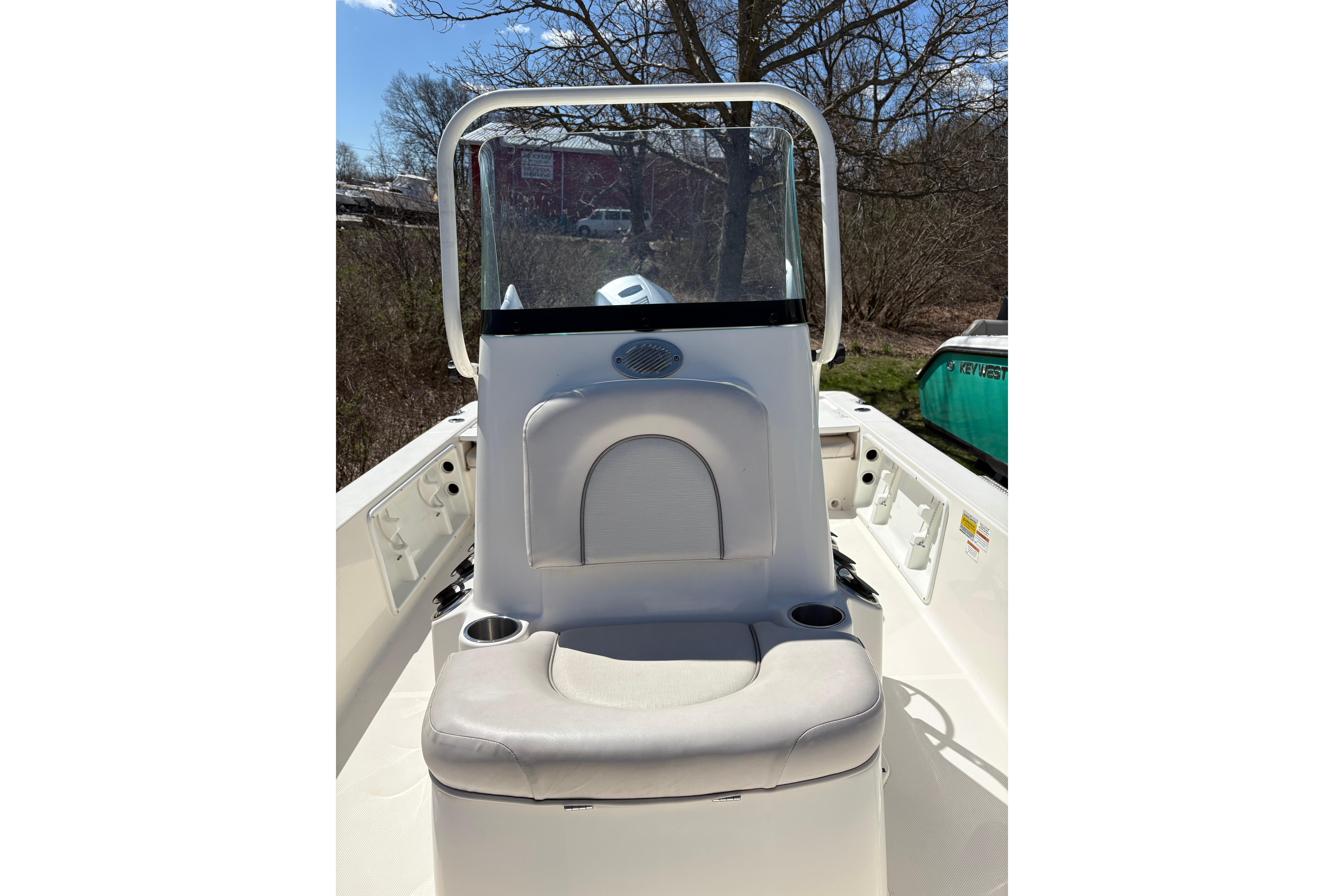 2021 Sea Born FX21 Bay boat interior with cushioned seating and windshield.