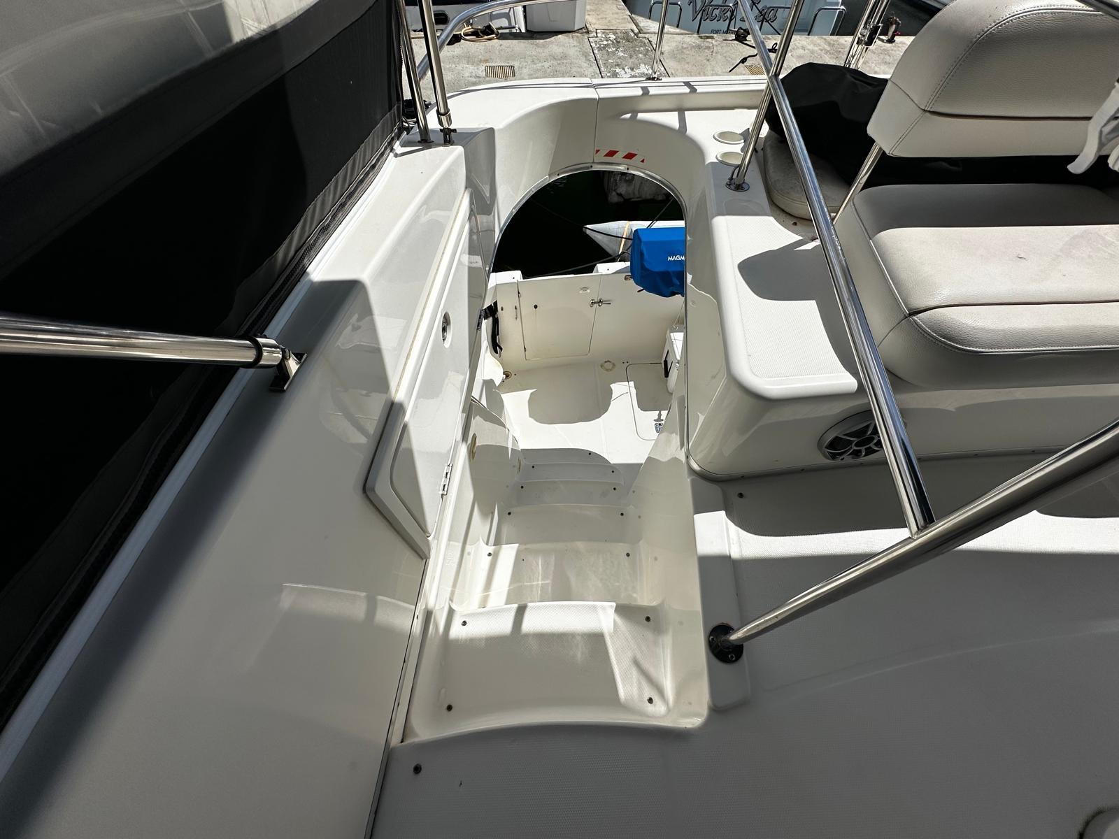 2006 Silverton 43 Sport Bridge yacht interior with seating and steps.