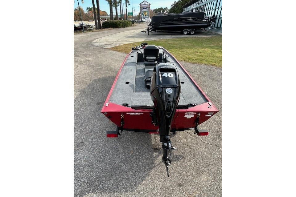 2025 Tracker Panfish 17 boat with Mercury 40 engine, parked outdoors.