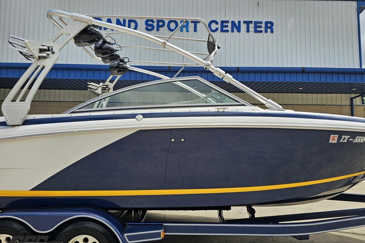 2010 Cobalt 232 WSS boat at Grand Sport Center, featuring sleek design and wakeboard tower.
