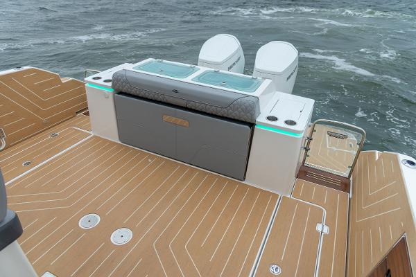 Manufacturer Provided Image: 2026 Regal LX43 boat deck with twin engines and sleek design on open water.