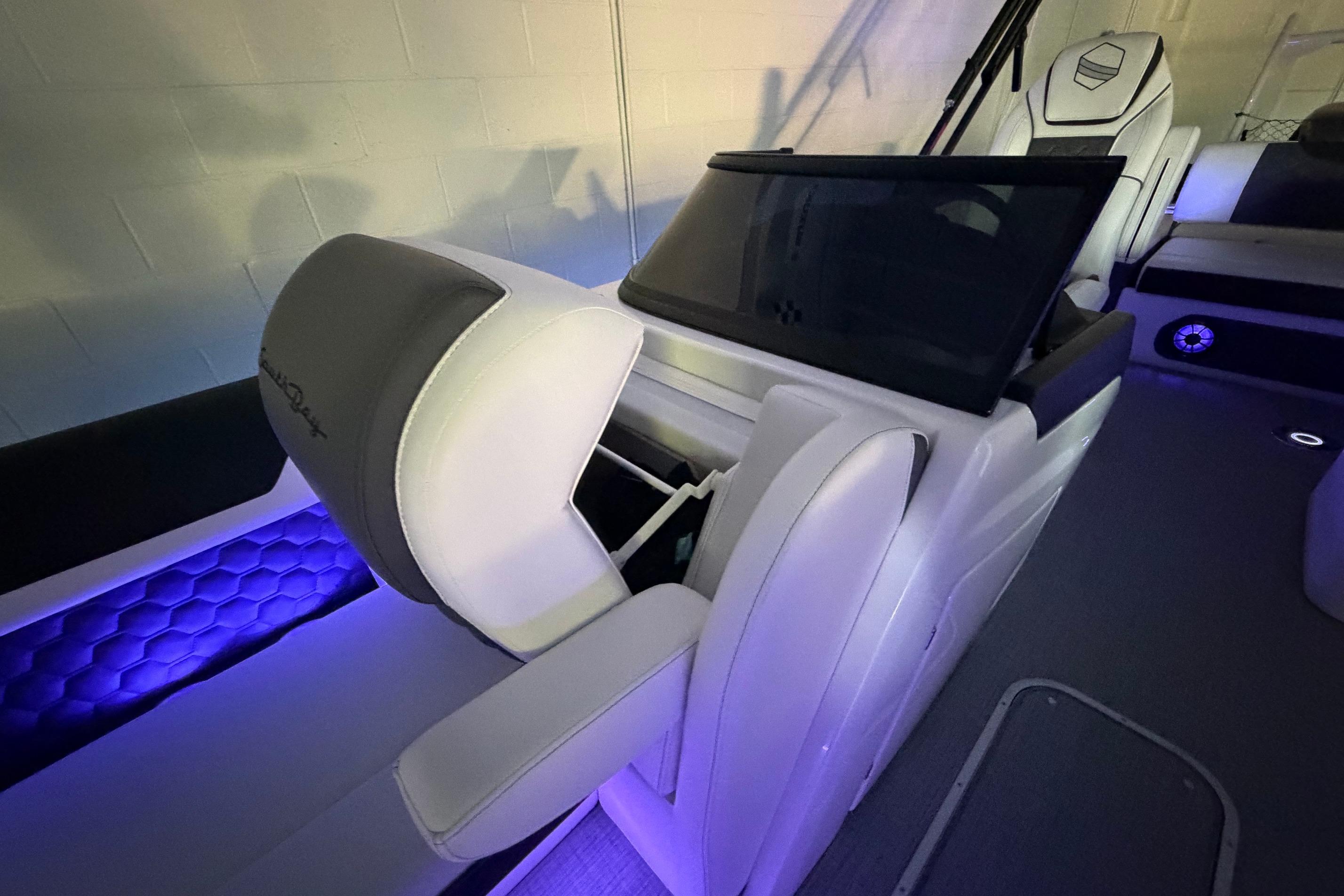 Luxurious interior of 2026 South Bay 525SB2 boat with ambient lighting and modern seating.