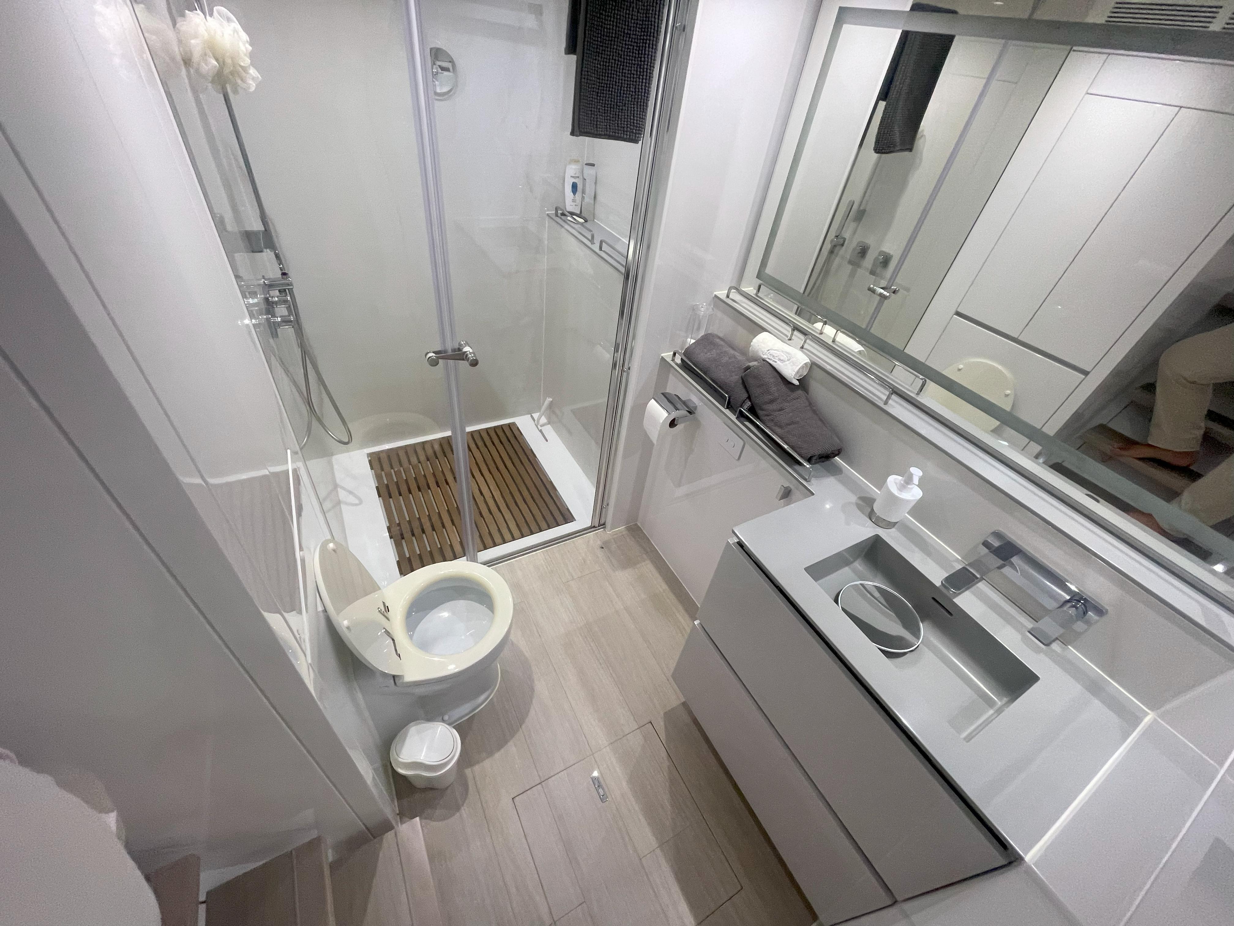 Luxurious bathroom in 2016 Sunreef 70 Power yacht with modern fixtures and sleek design.
