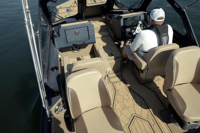 2026 SeaArk Dynasty 2.0 boat interior with beige seating and modern dashboard.