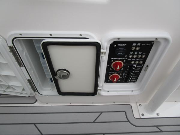 Control panel of 2025 Solara S-250 CW boat with open access hatch.