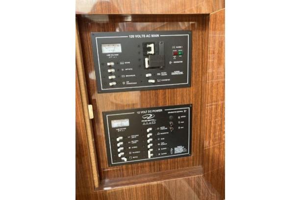 Electrical panel of 2013 Regal 30 Express boat, featuring AC and DC power controls.