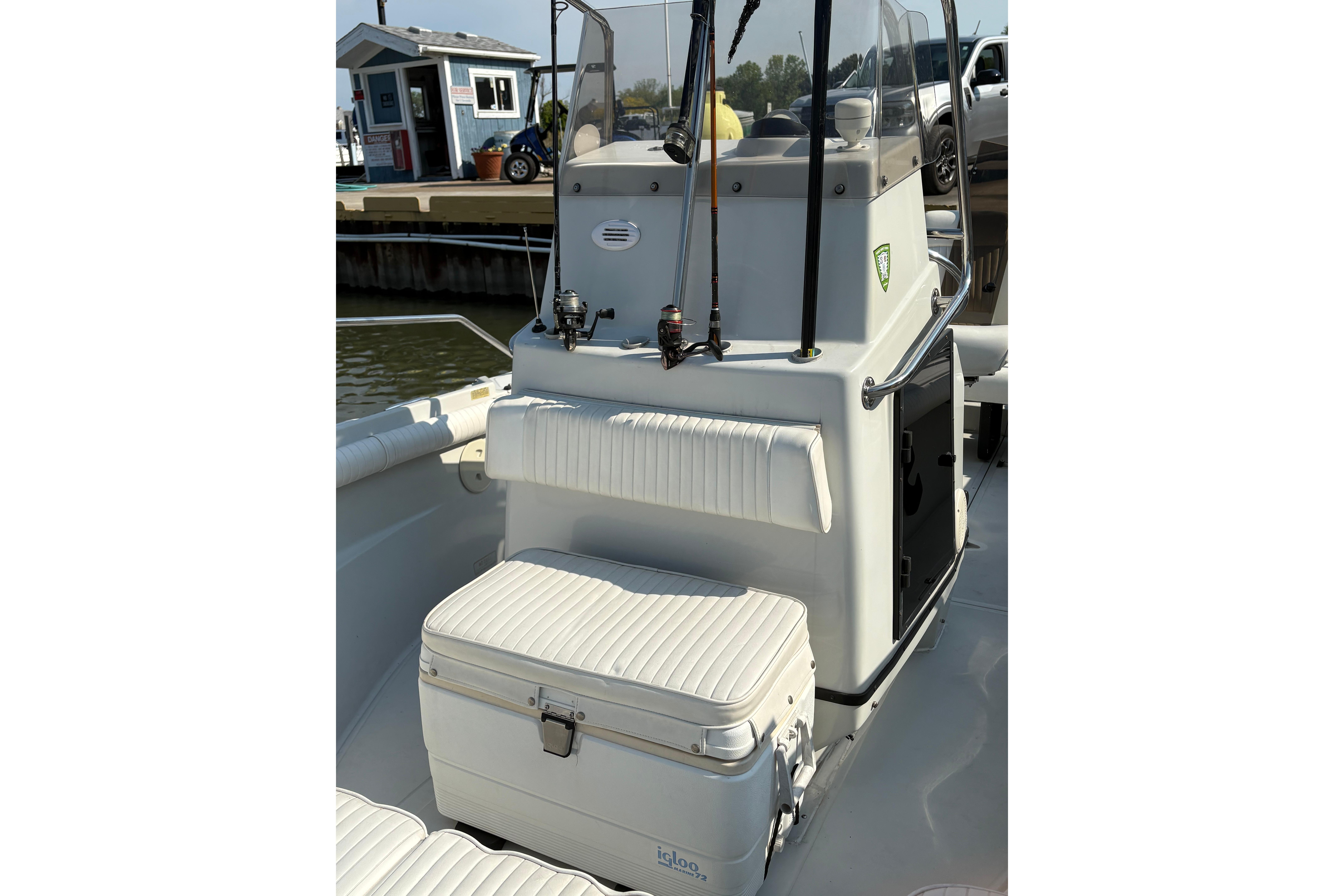 1993 Boston Whaler 21 Outrage boat interior with seating and cooler.