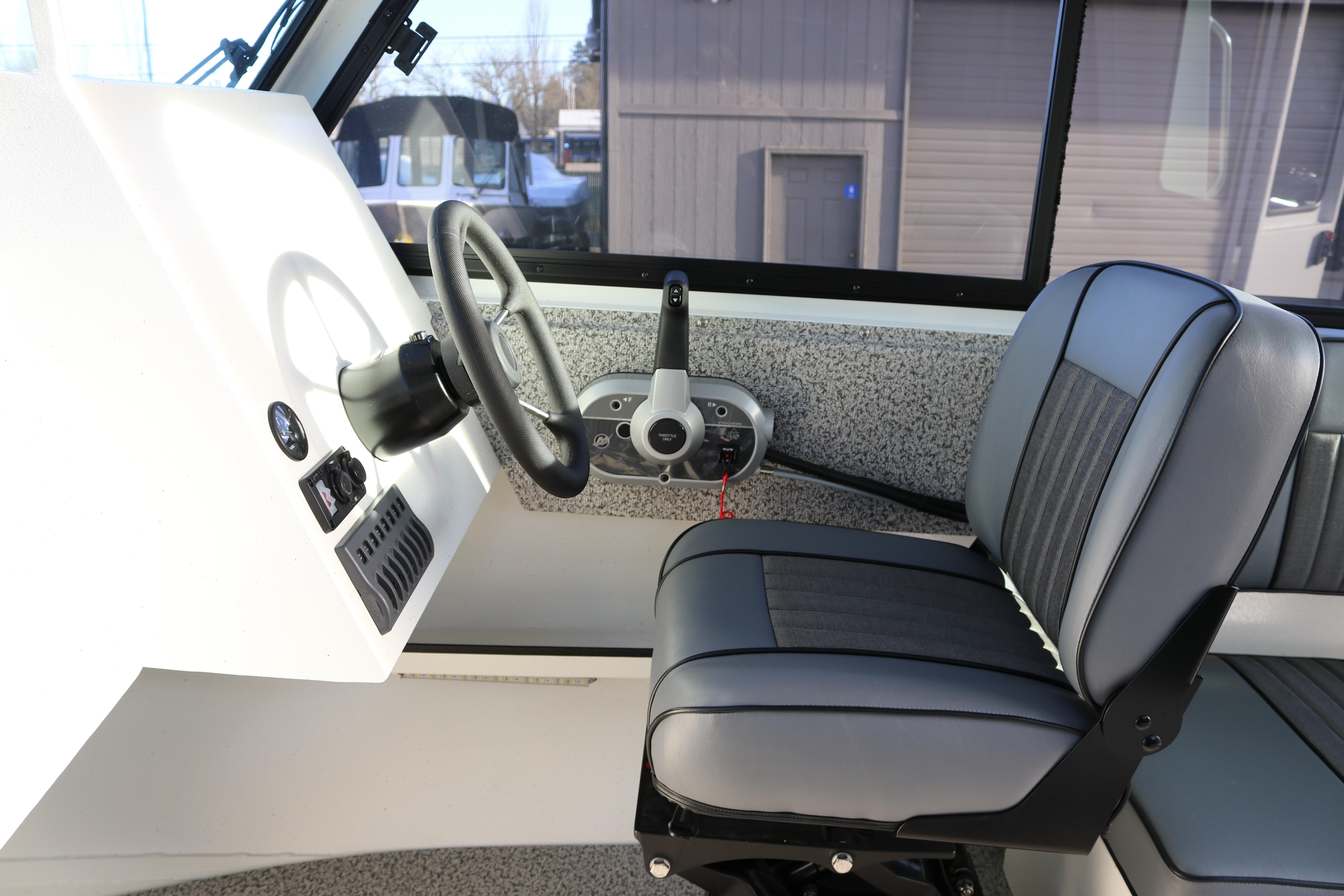 2026 Alumaweld Intruder Outboard 22 interior with steering wheel and seat.