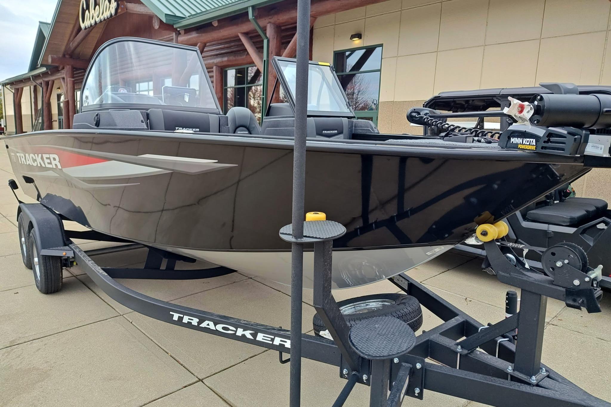 2026 Tracker Targa V-19 WT boat on trailer outside Cabela's store.