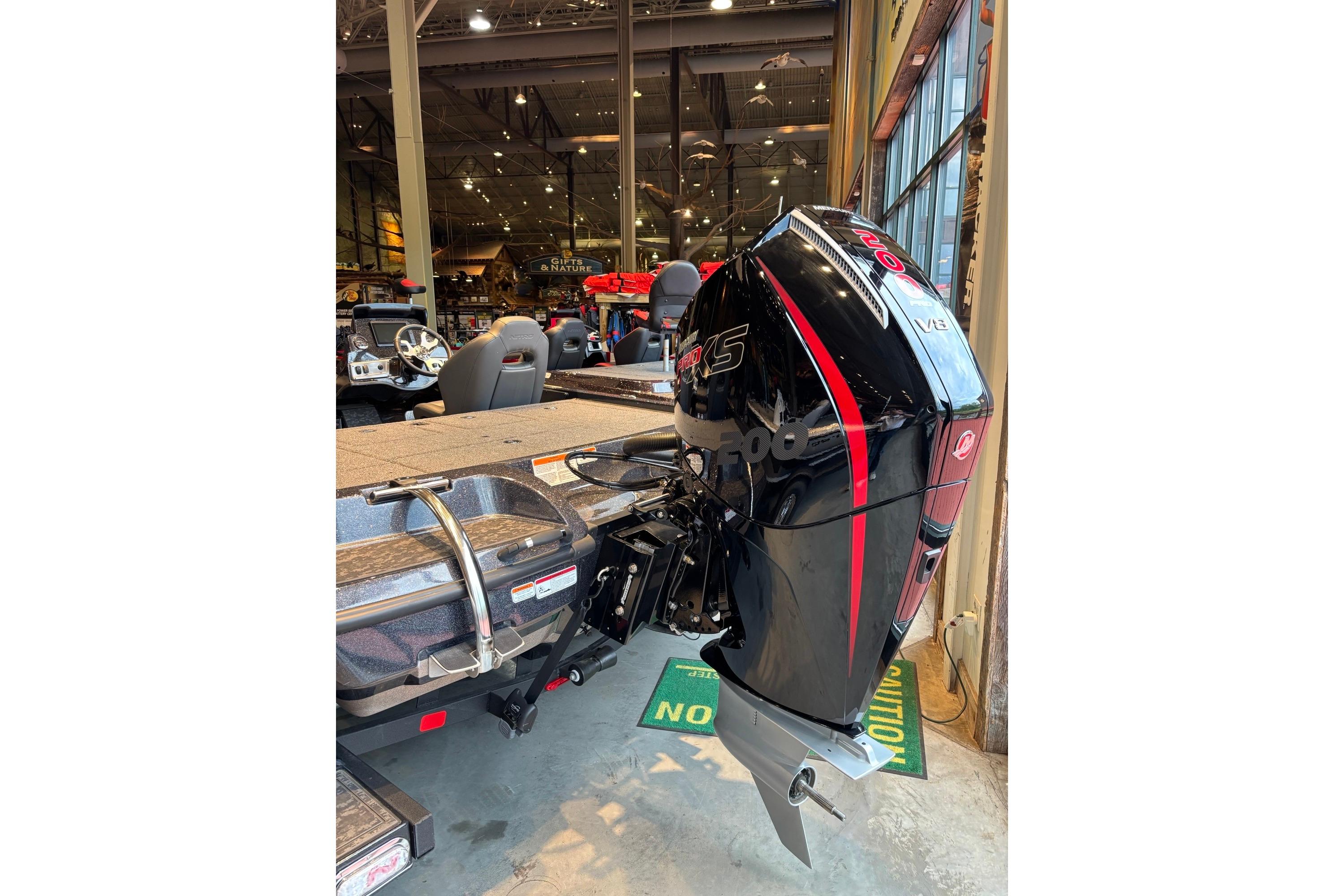 2026 Nitro Z19 XL Pro boat with powerful outboard motor in showroom.