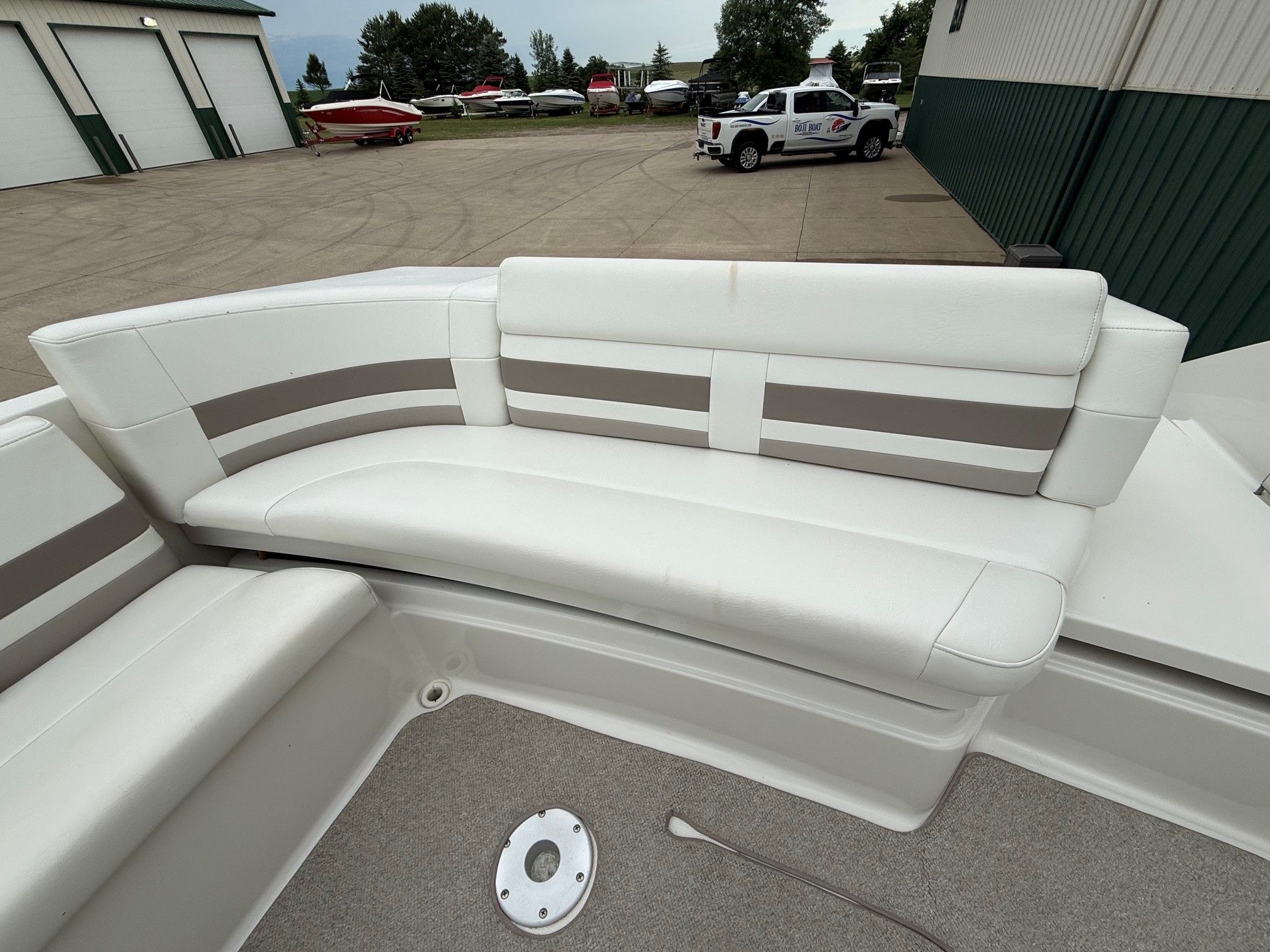 Interior of a 1998 Formula Thunderbird boat with white seating.