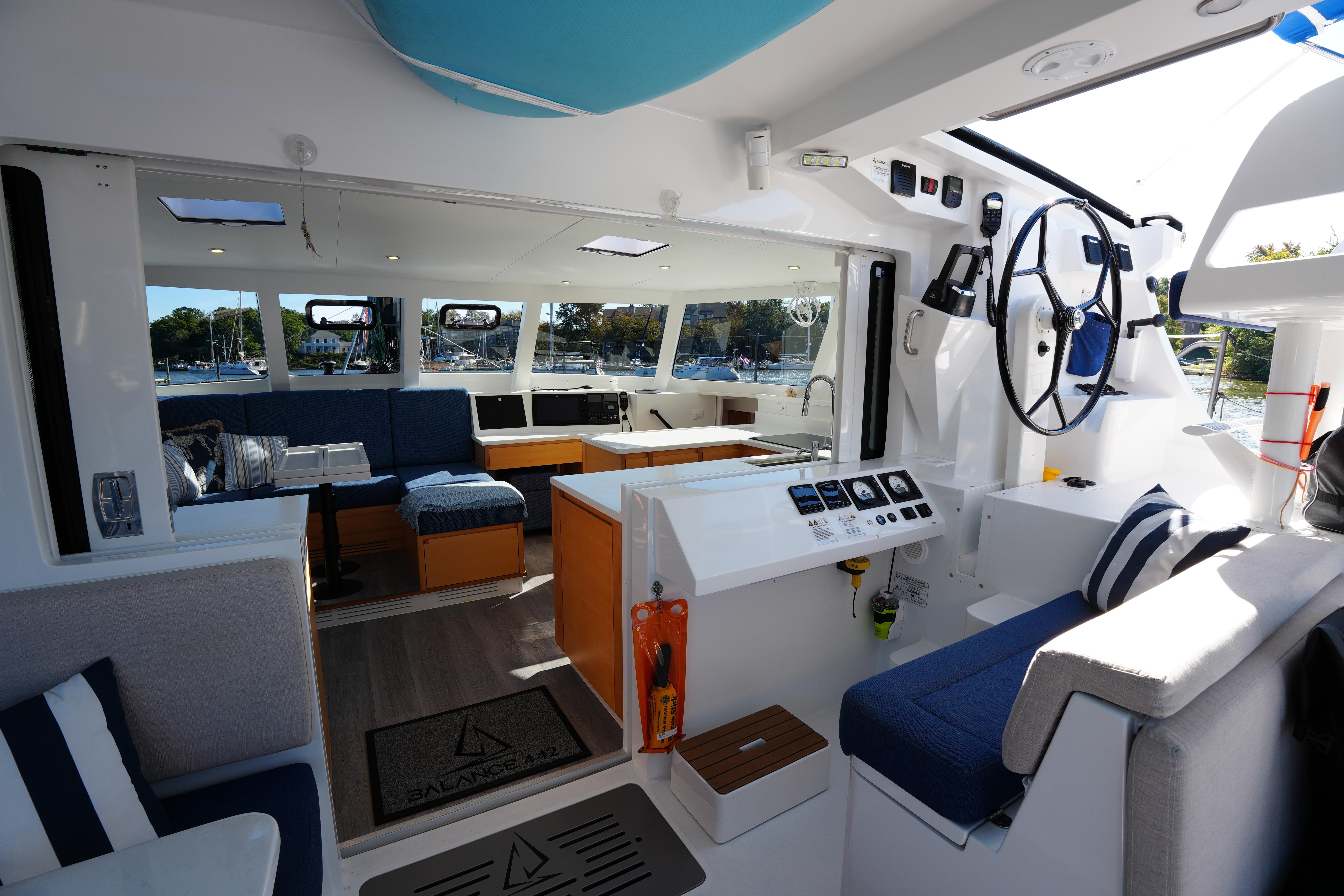 2024 Balance 442 yacht interior with modern design, spacious seating, and navigation controls.