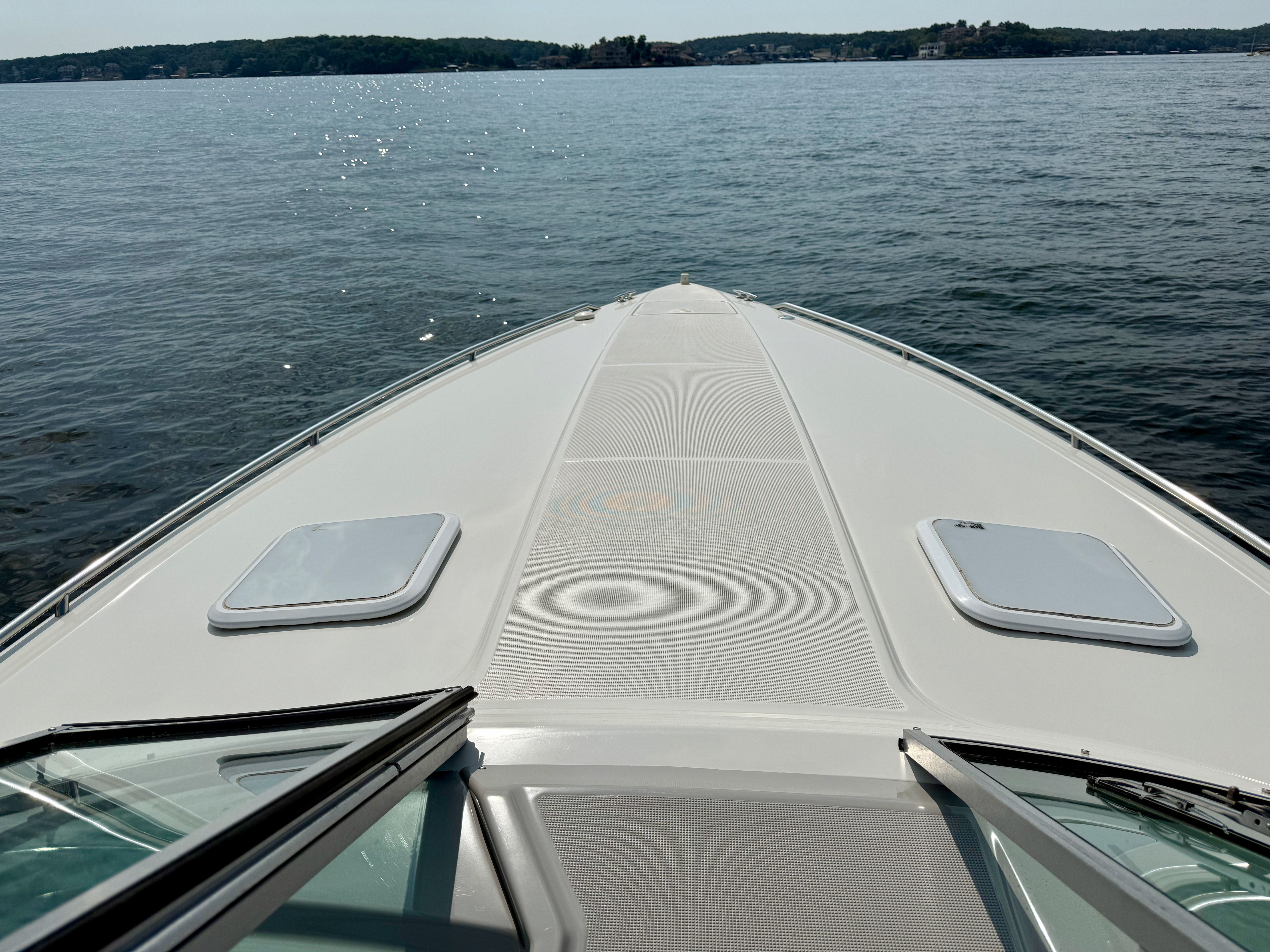 2001 Formula 330 Sun Sport boat on calm water.