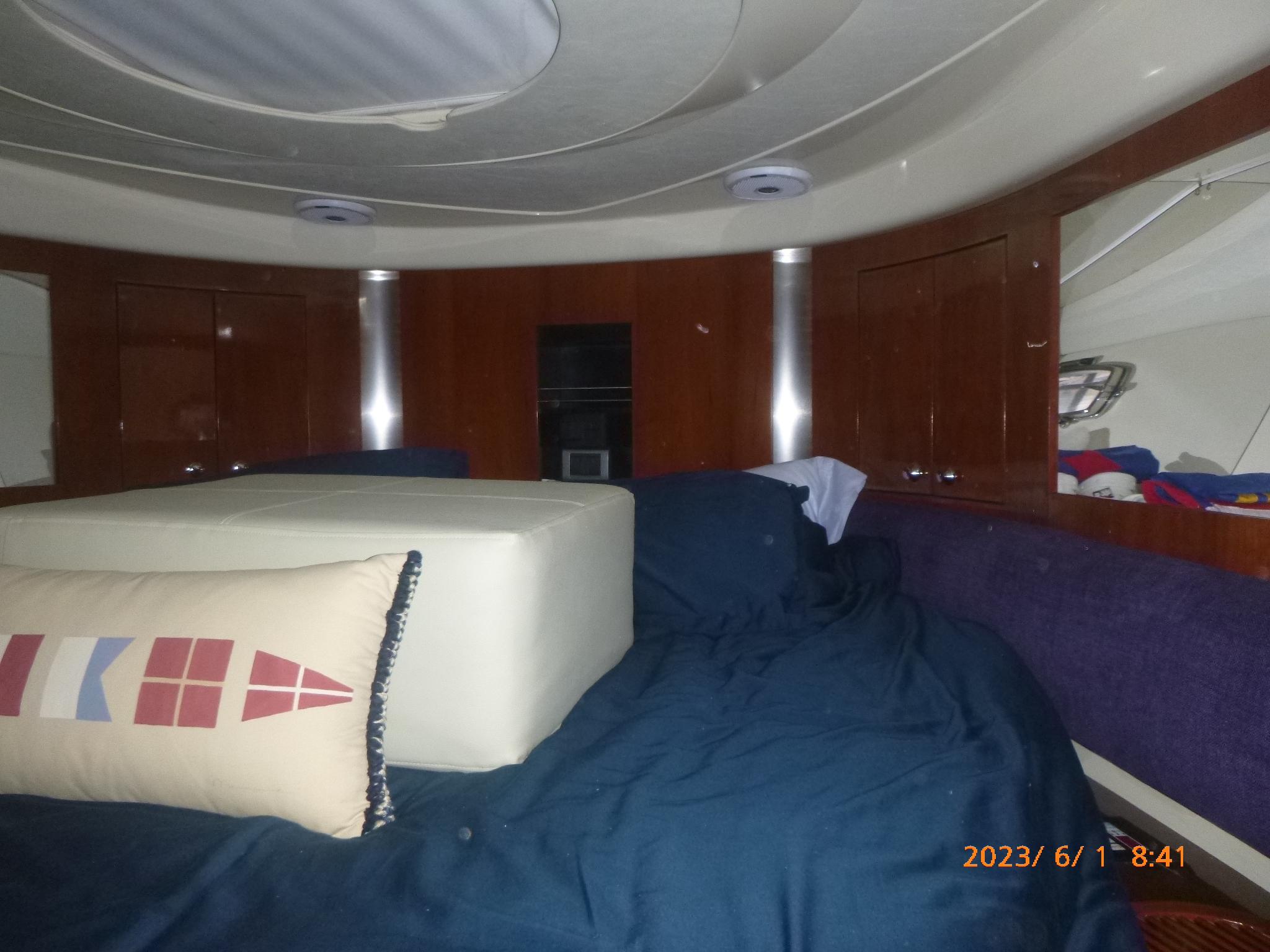 Interior cabin of 2007 Fairline Targa 52 GT yacht with bed and nautical decor.