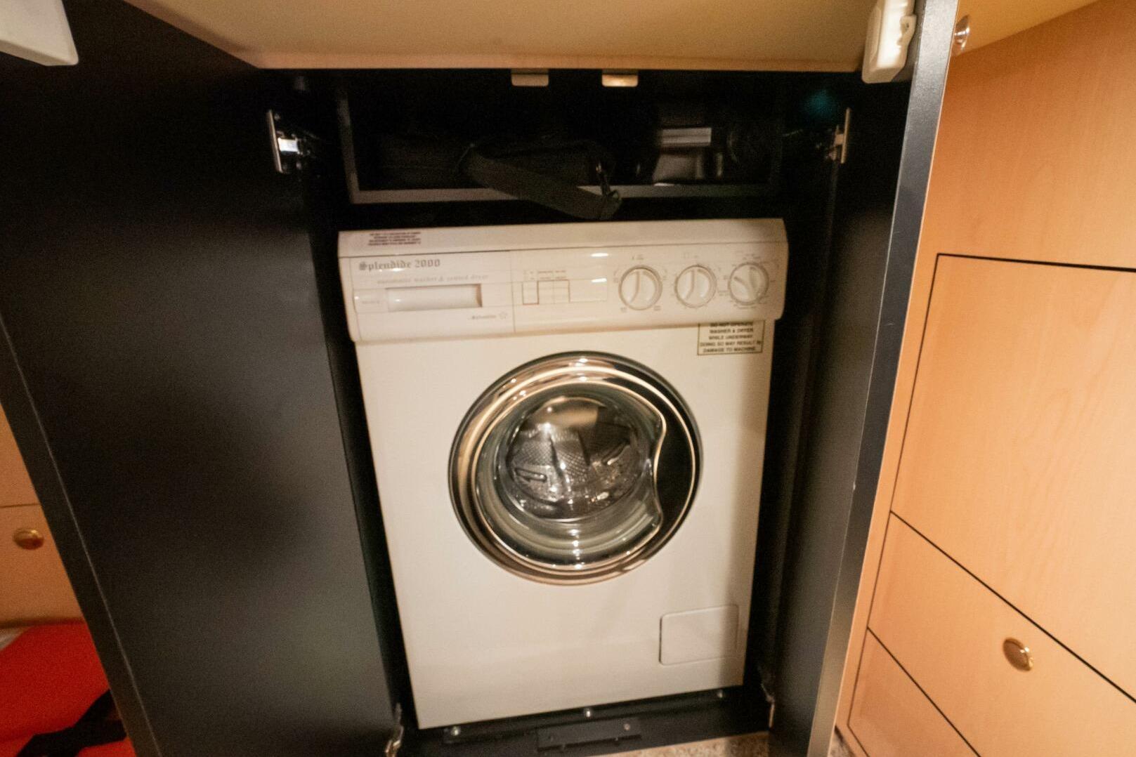 Washing machine inside 2003 Sea Ray Sundancer 460 yacht cabinet.