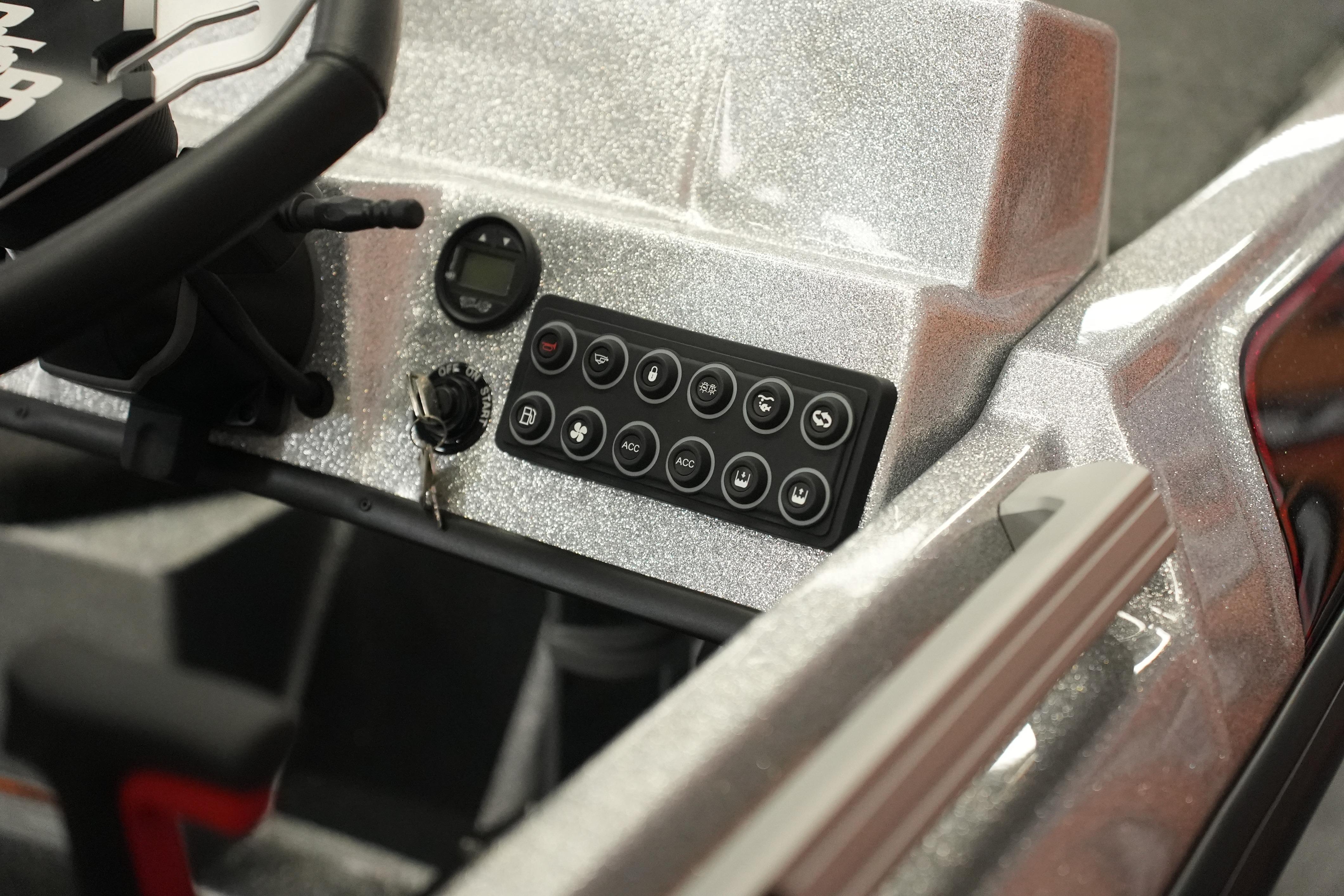 2026 Bass Cat Lynx STS dashboard with control panel and ignition key.