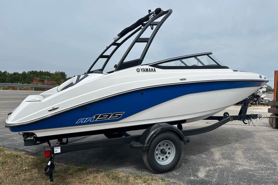 2026 Yamaha AR195 boat on trailer, featuring sleek design and blue accents.