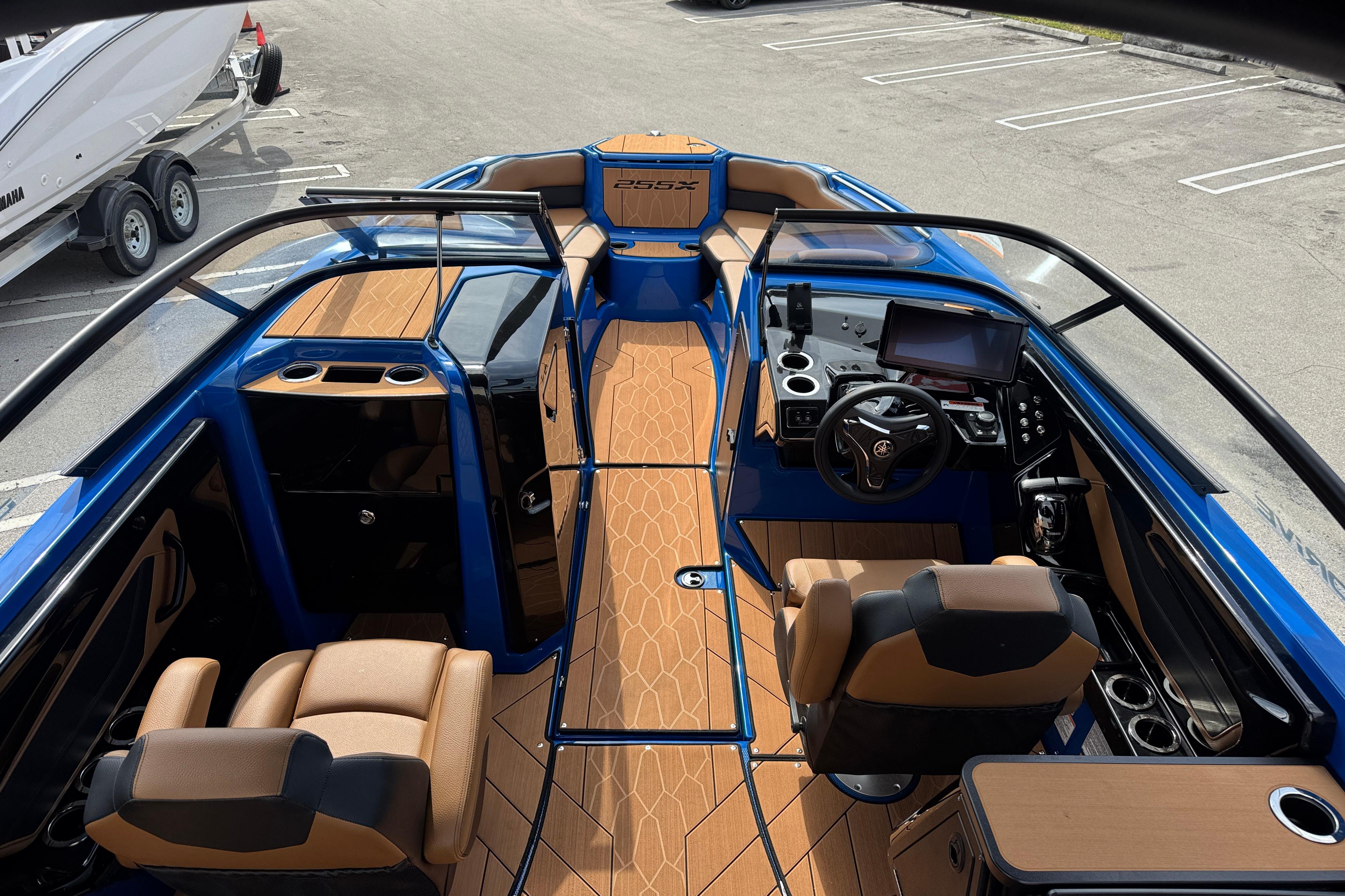 2026 Yamaha Boats 255XD interior with modern dashboard and seating, featuring sleek design elements.