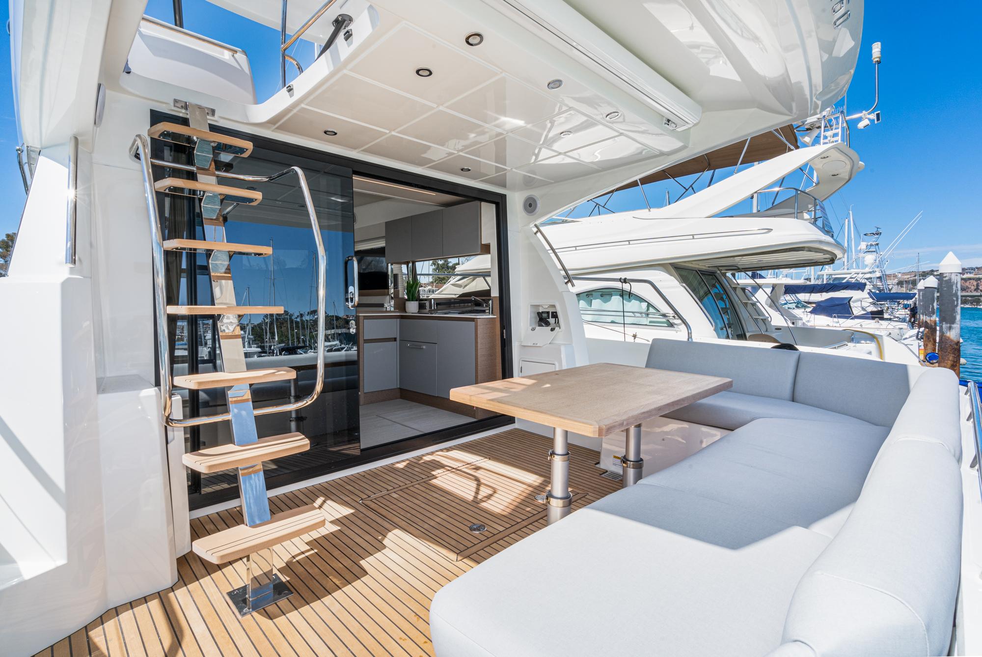 Prestige 460 yacht 2022 model, featuring a luxurious outdoor seating area and modern interior.