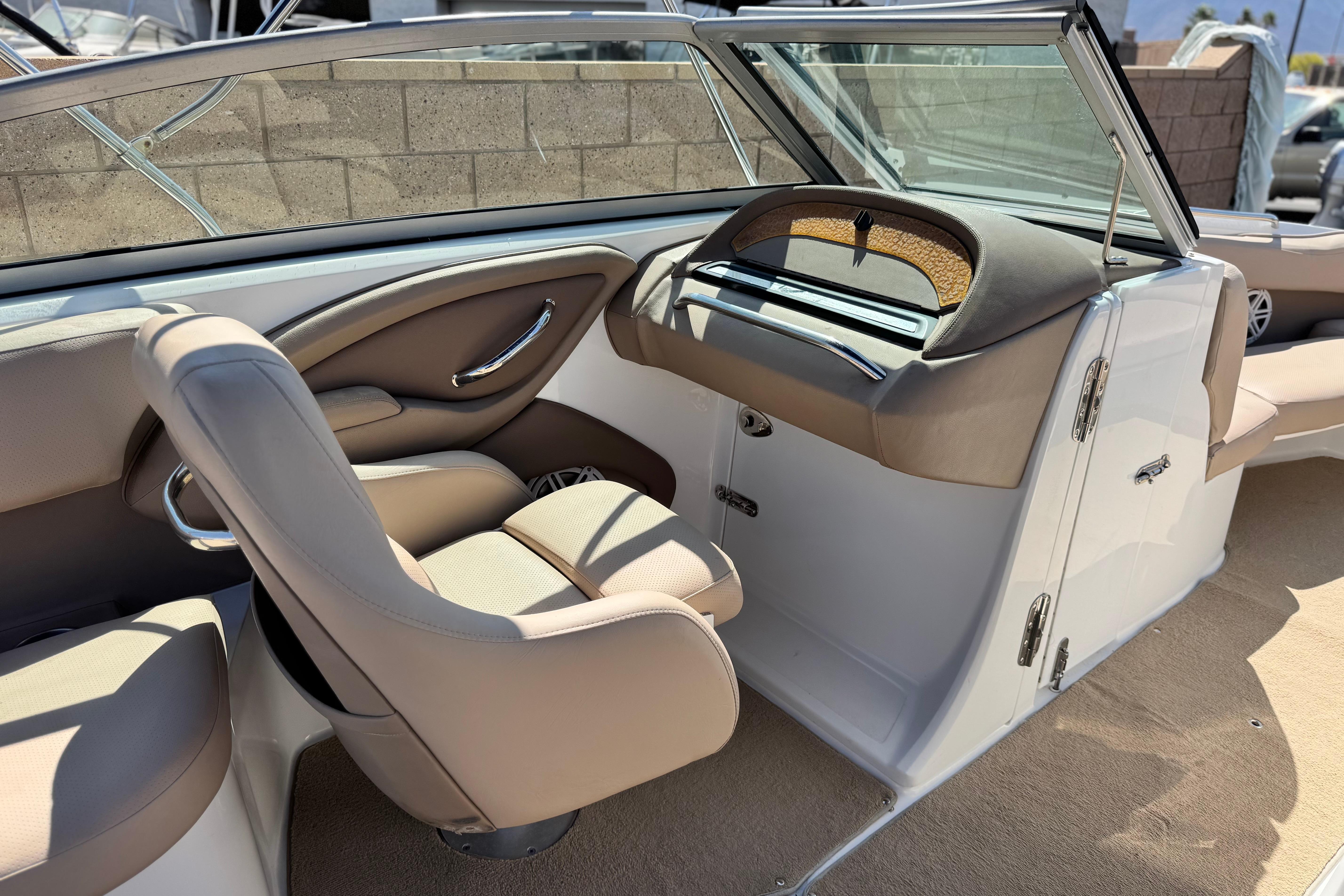 Interior of a 2008 Cobalt 262 boat with beige seating and dashboard.