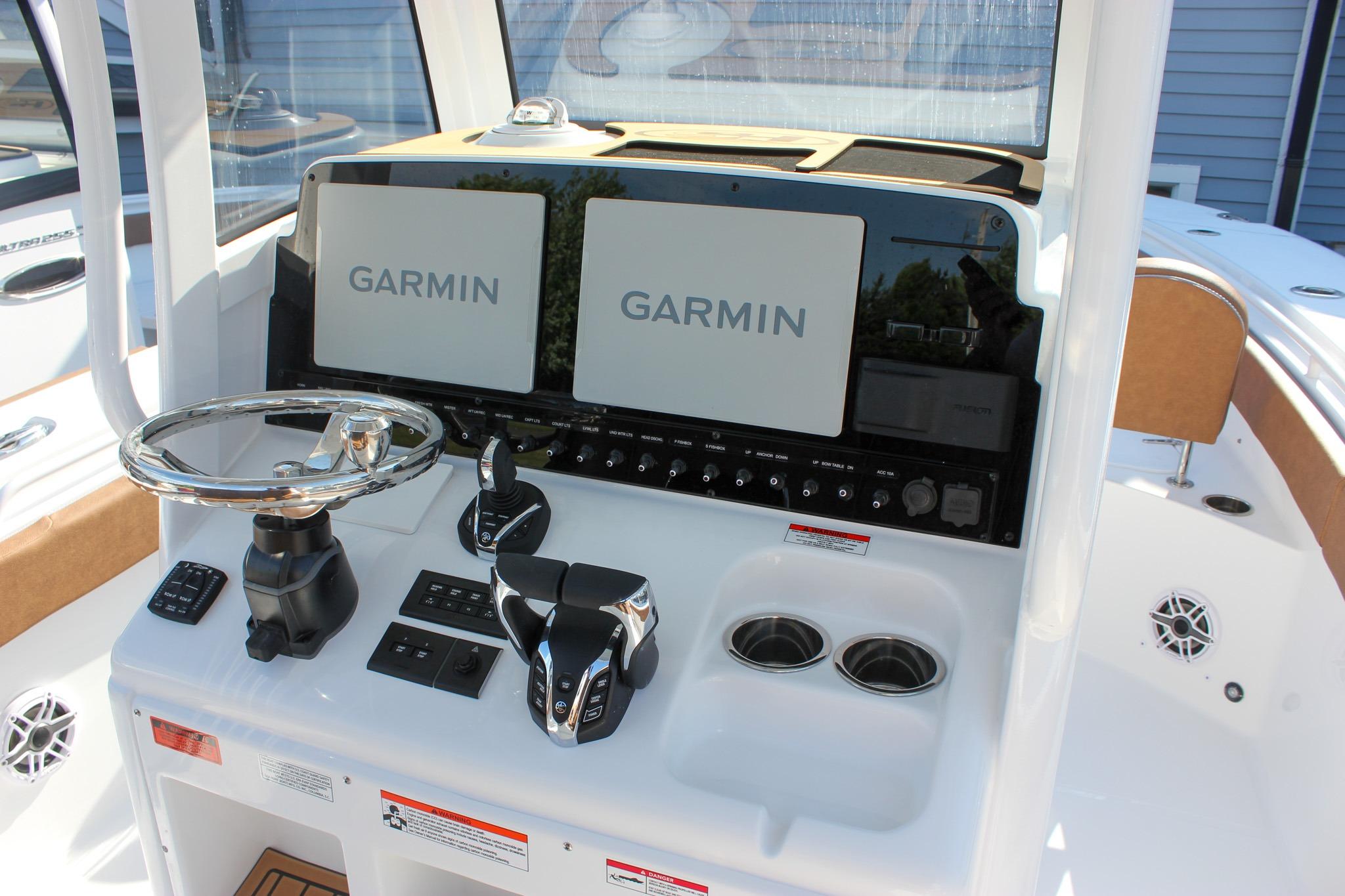 2027 Sea Hunt Ultra 275 SE boat dashboard with dual Garmin displays and modern controls.