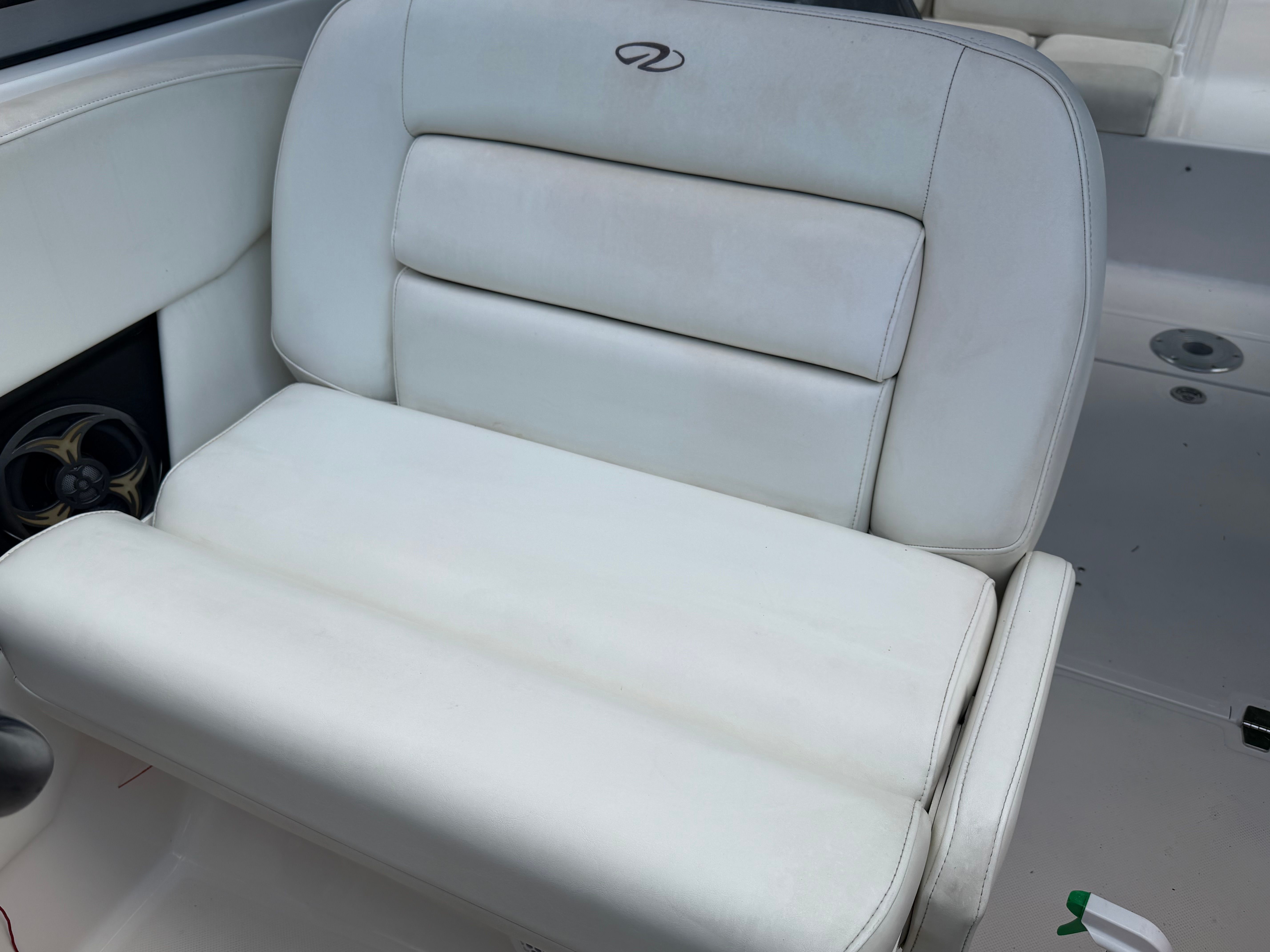 White cushioned bench with Regal logo on a boat.