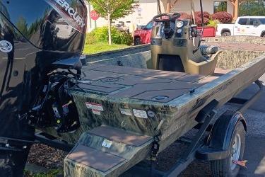 2026 Tracker Grizzly 1860 CC boat with Mercury engine on trailer.